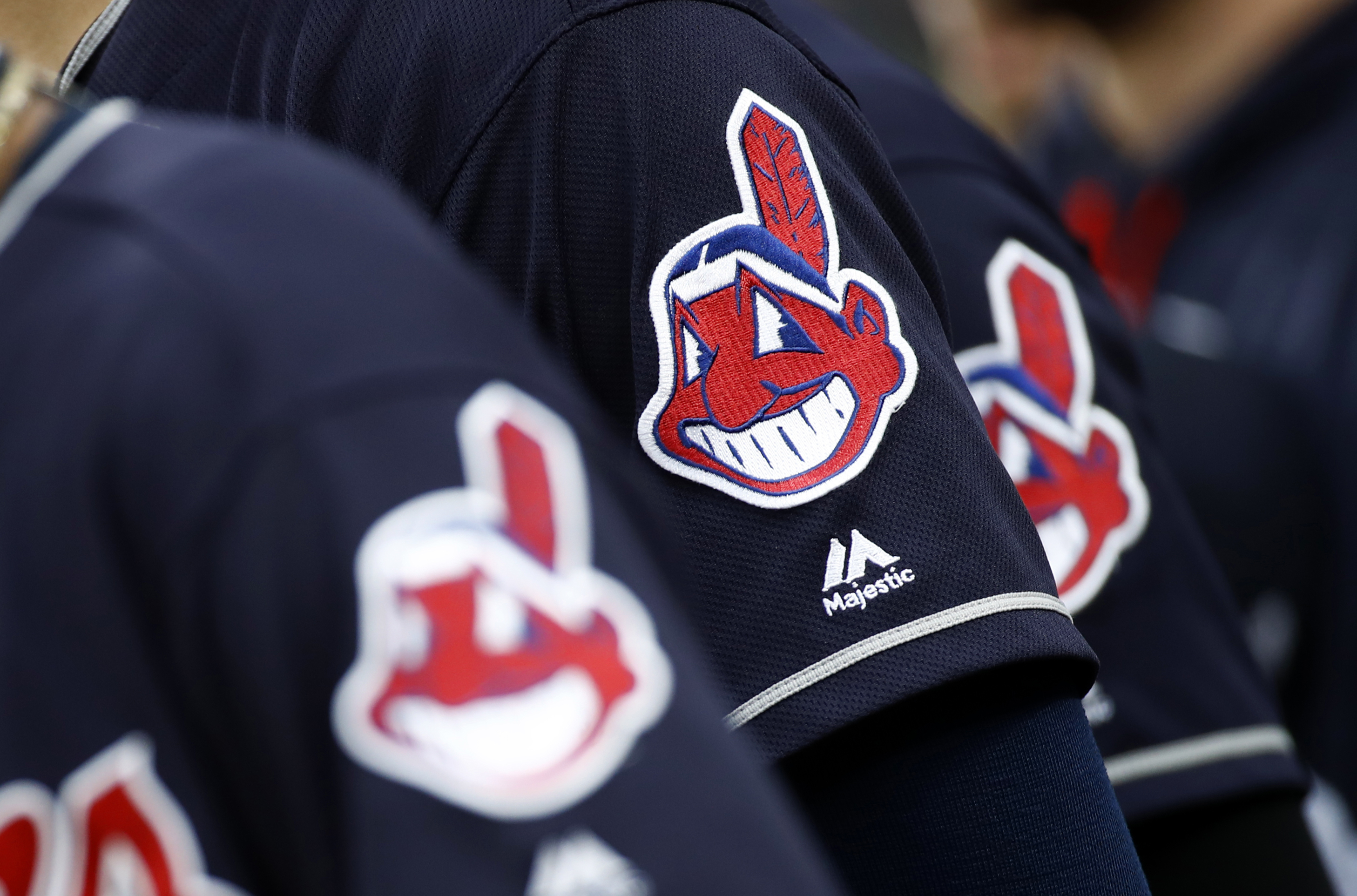 Members of the Cleveland Indians wear uniforms featuring mascot Chief Wahoo, which has been condemned as a racist image