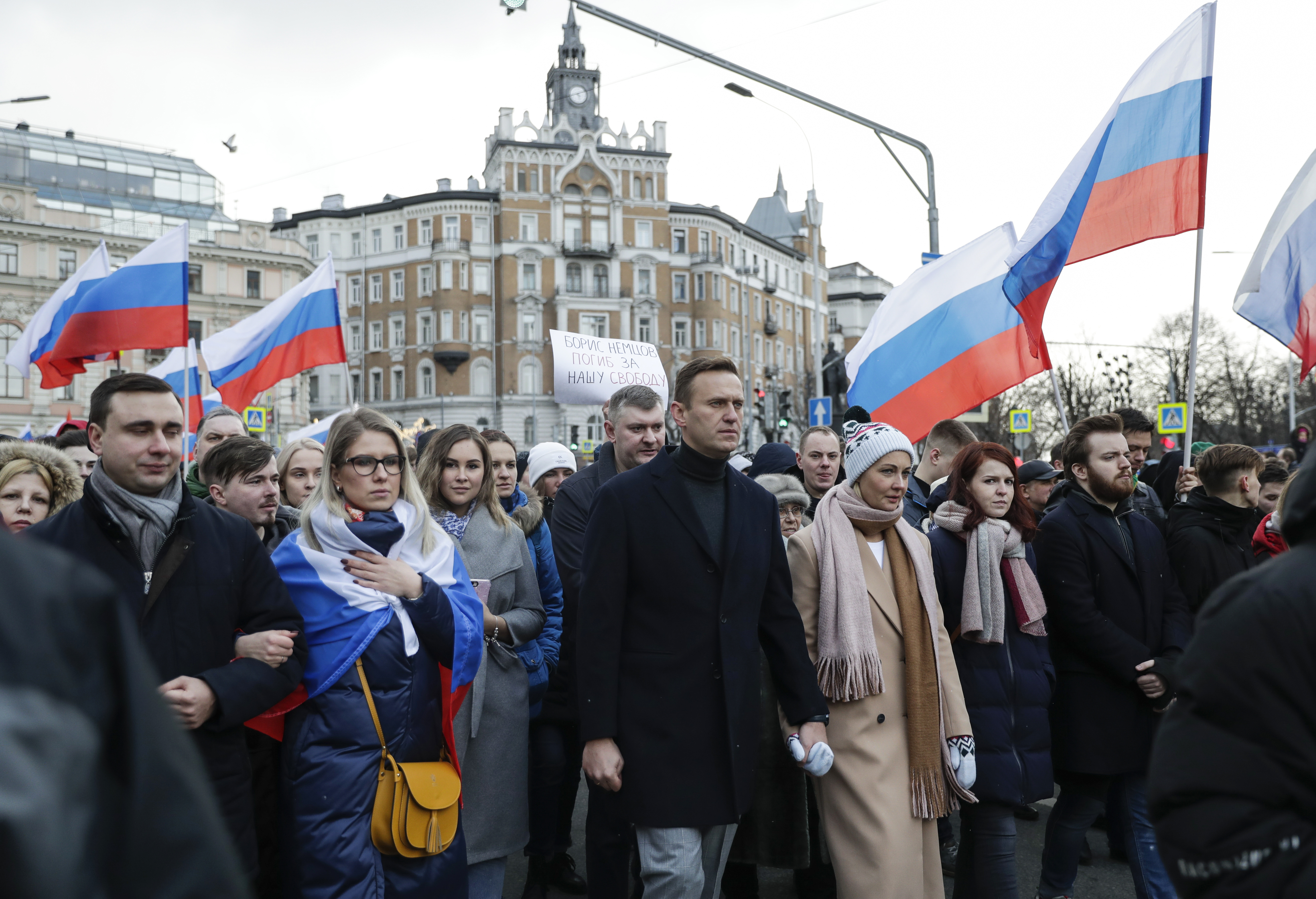 Navalny, centre, wife Yulia, left of him, and opposition activist Lyubov Sobol, second from left, take part in a march in Moscow