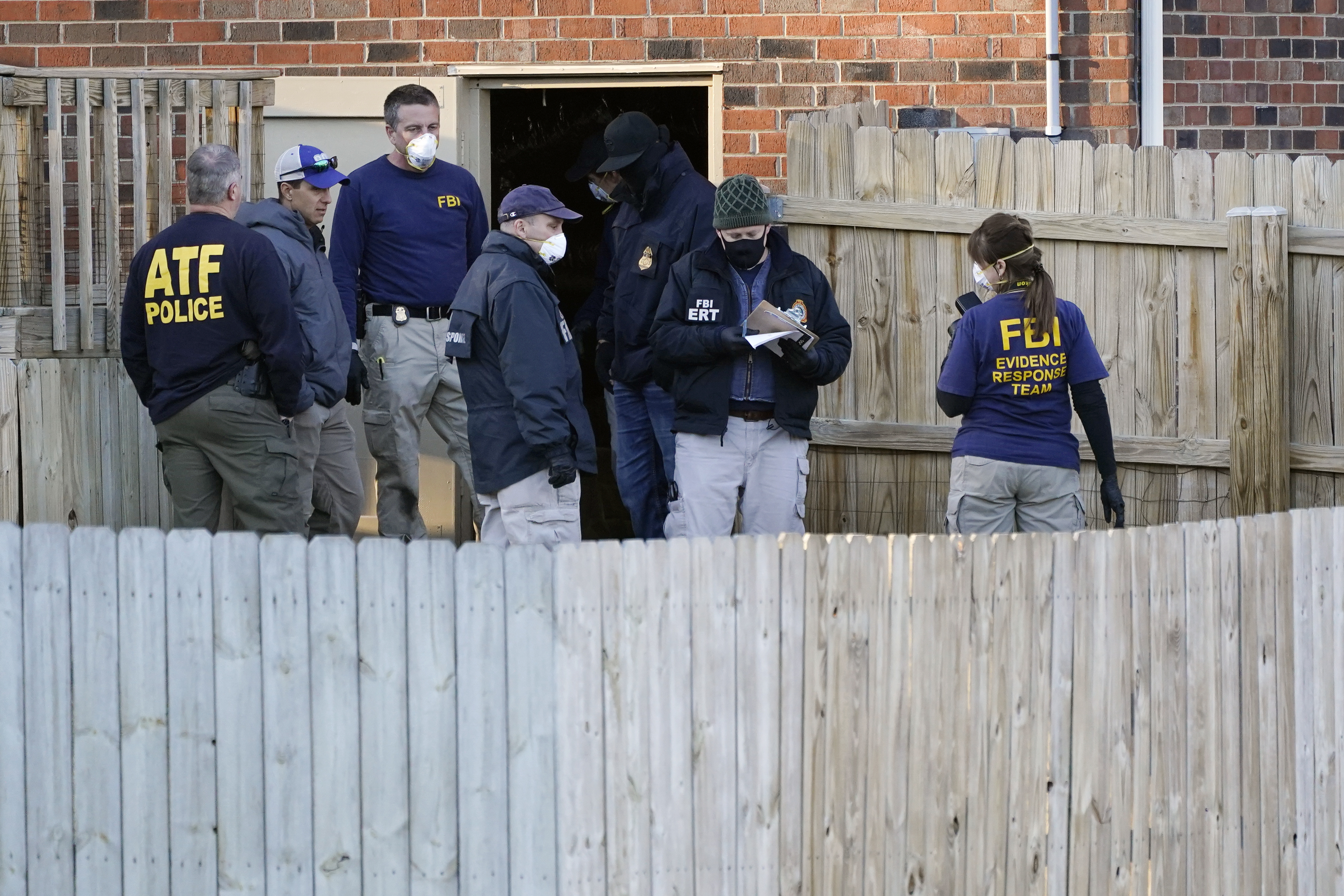 FBI and ATF agents search the basement of a home in Nashville, Tennessee