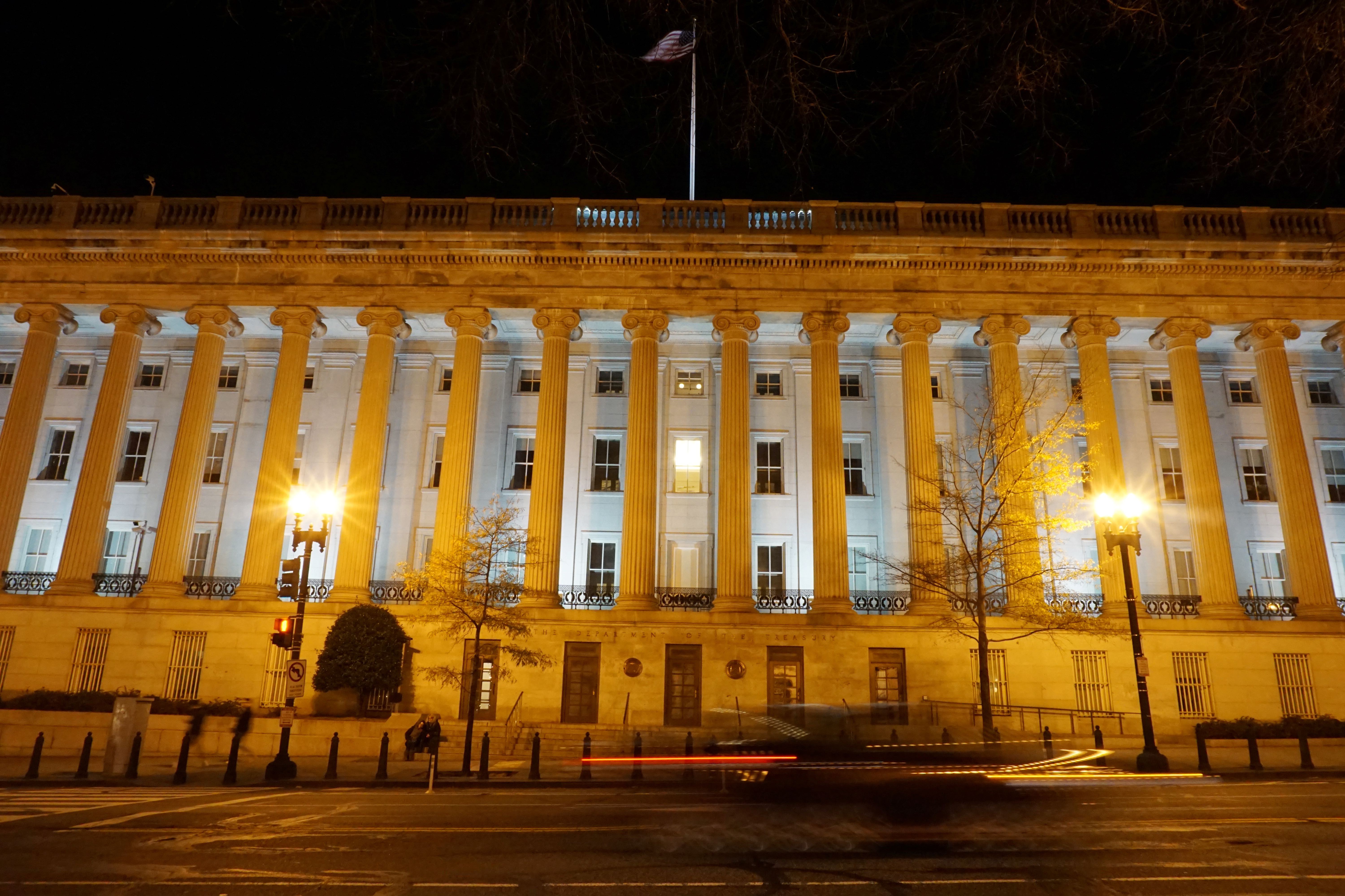 A vehicle drives past the US Treasury Department in Washington, DC, US
