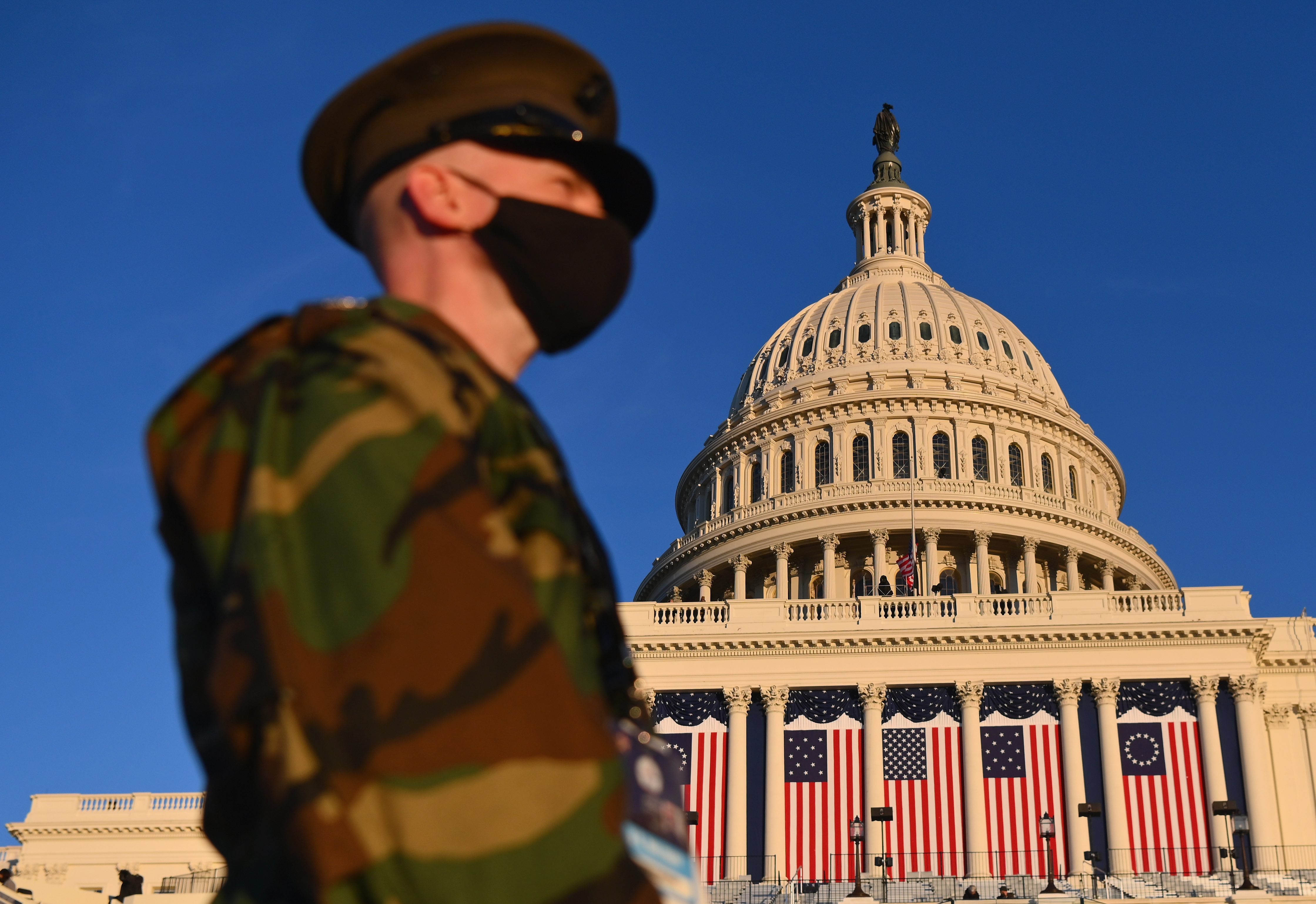 View of the US Capitol as the sun sets ahead of the 59th inaugural ceremony for President-elect Joe Biden and Vice President-elect Kamala Harris in Washington, DC on January 19, 2021, which was heavily guarded by US military forces
