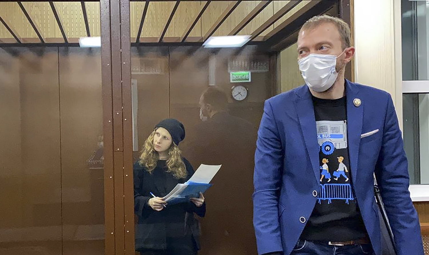 Russian opposition activist Maria Alyokhina is seen inside a defendant dock at the Tverskoi district court as the court is to hold hearings