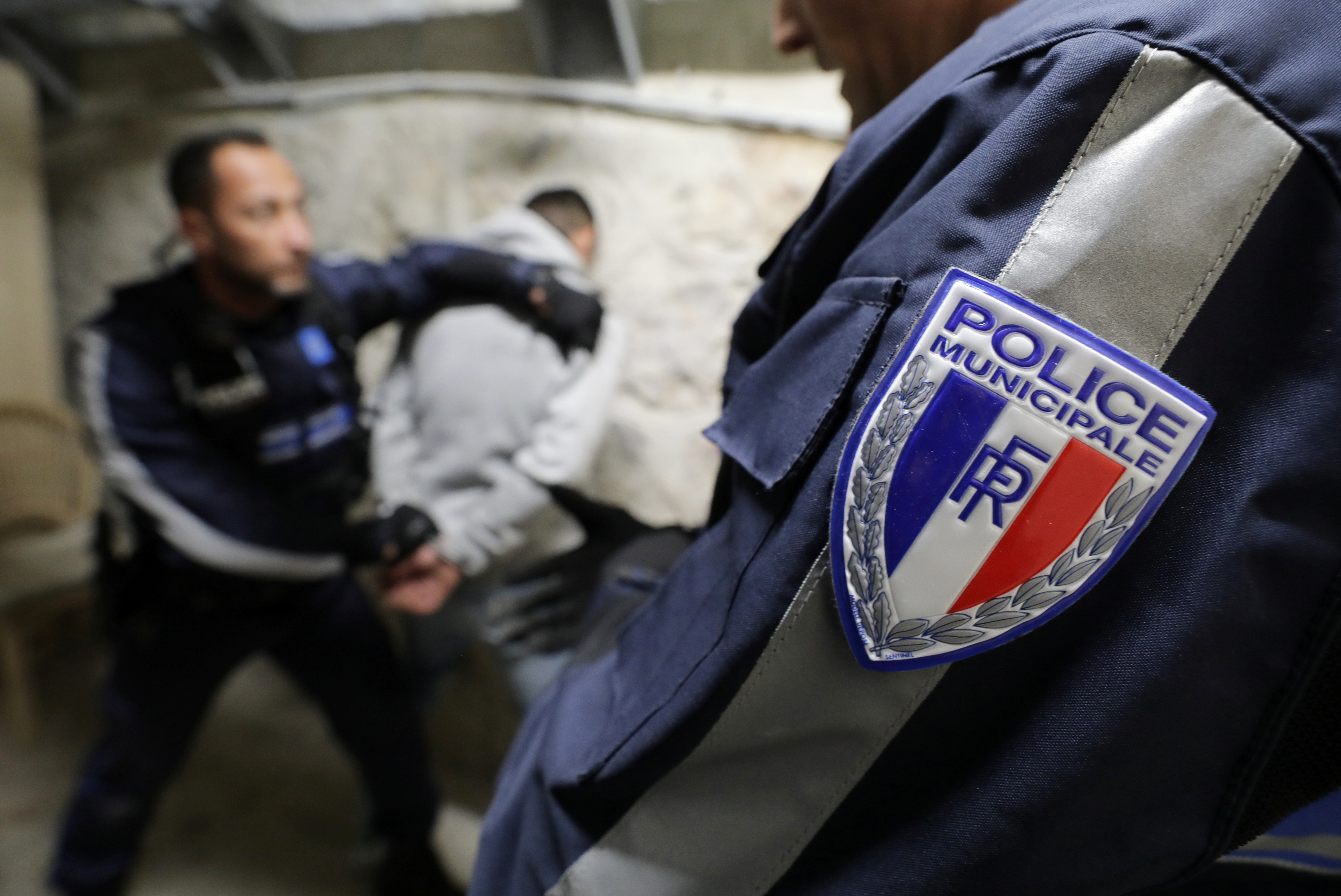 A French police officer shows how to arrest a suspect during national security day in Nice, France.[File: REUTERS/Eric Gaillard]