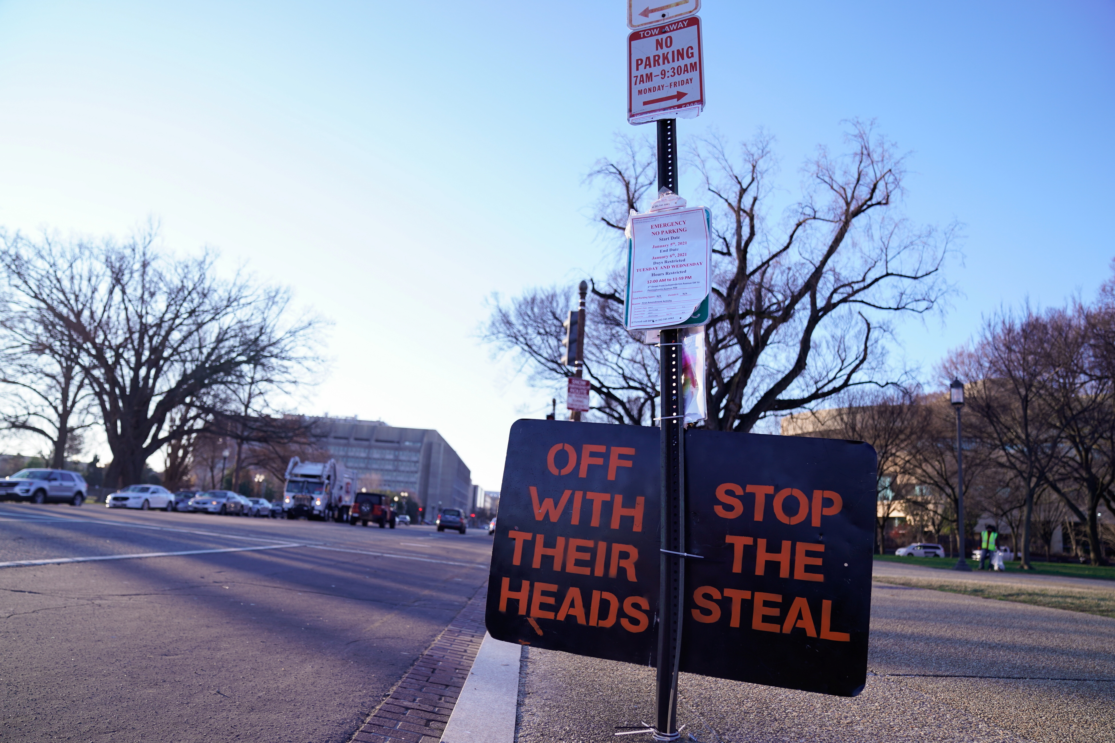 A protest sign is tied to a city street post near the US Capitol, January 7, 2021
