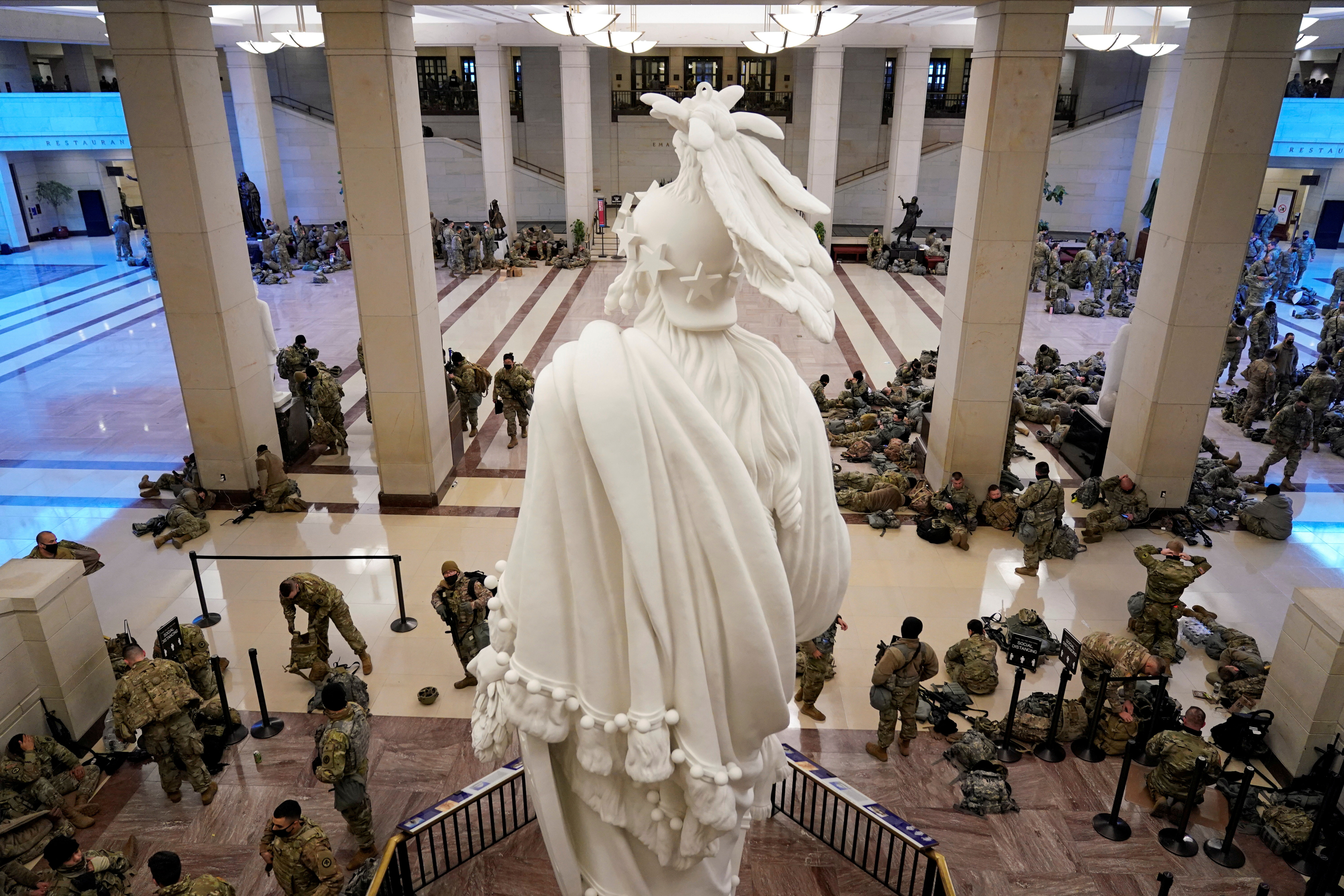 National Guard members assemble in the Capitol Visitor’s Center on Capitol Hill on Wednesday