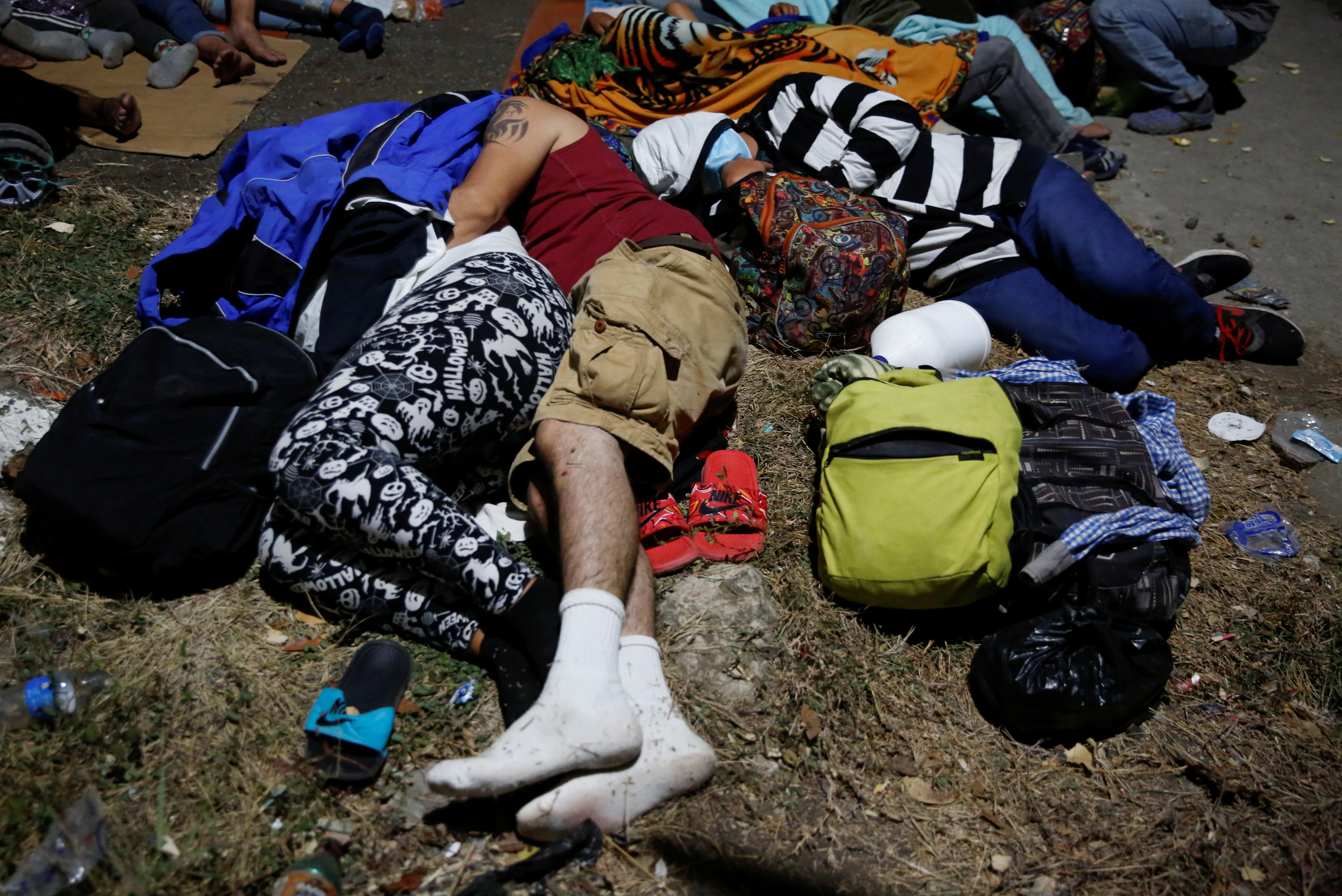 Hondurans taking part in a new caravan of migrants, some of whom hope to reach the United States, take a break in Vado Hondo, Guatemala on January 16