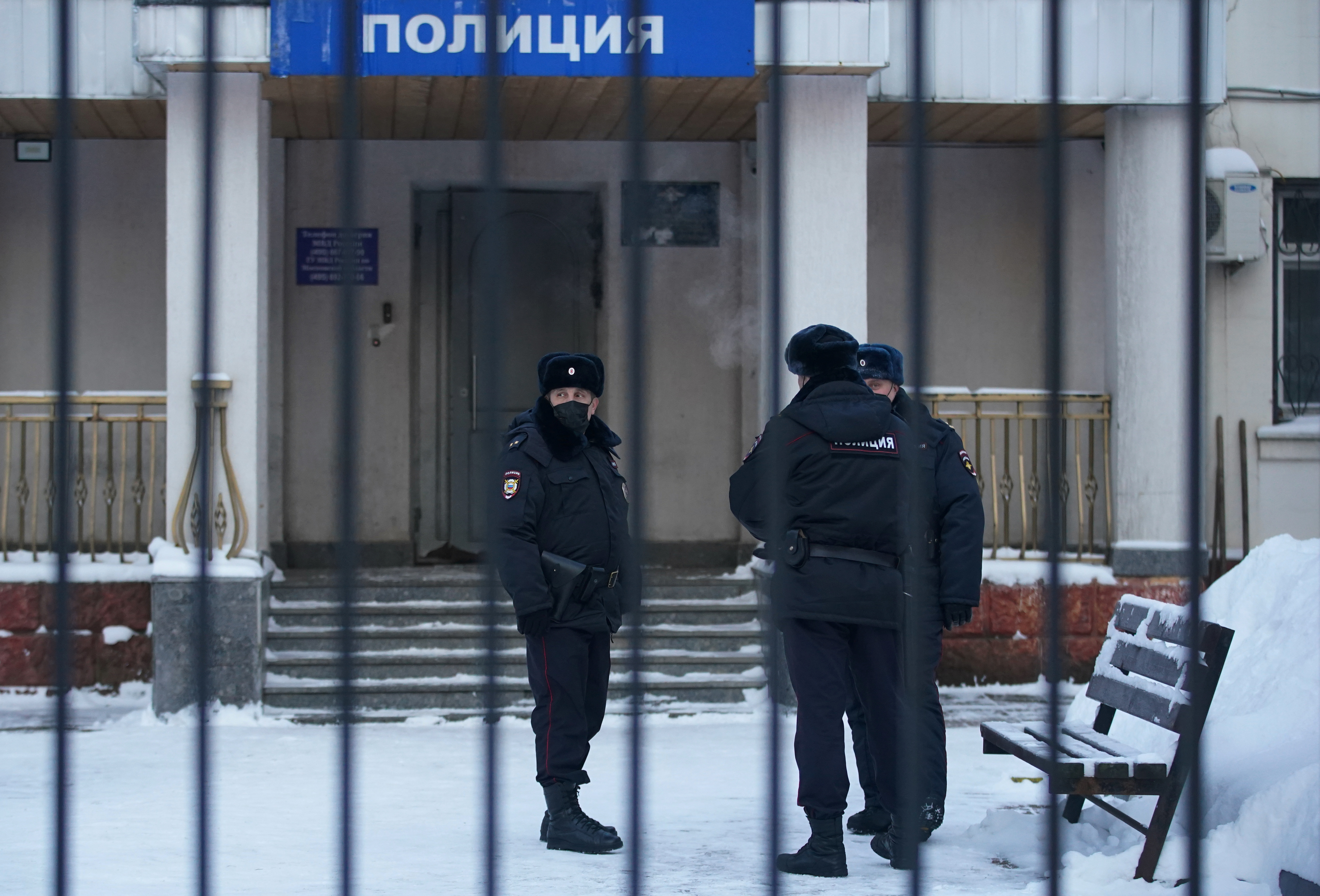 Police officers stand outside a police station where detained Russian opposition leader Alexey Navalny is being held, in Khimki outside Moscow, Russia January 18, 2021