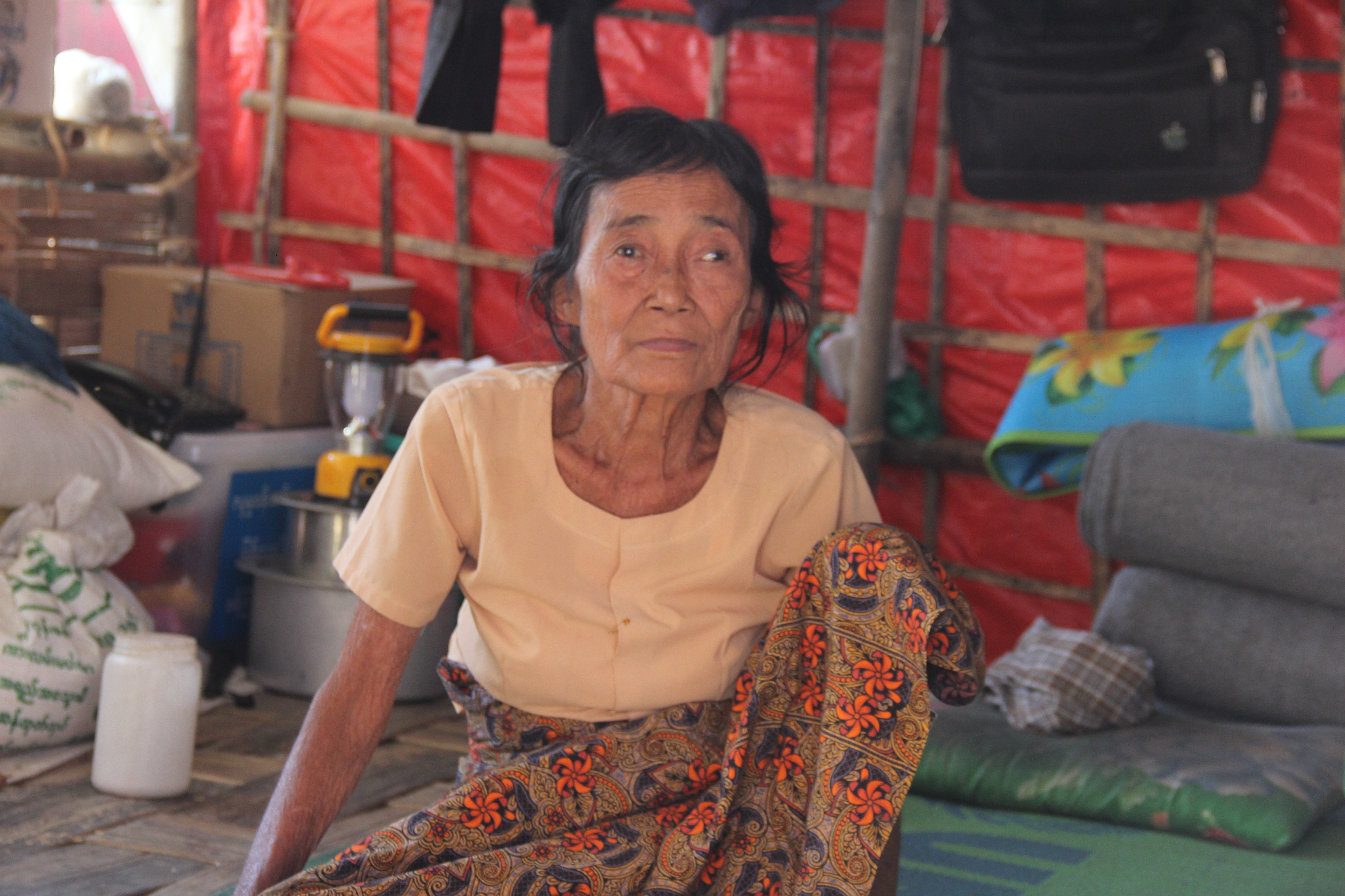 A woman whose son was arrested in the Tinma village tract last March now lives in a temporary shelter in a railway station after the villagers’ homes were razed