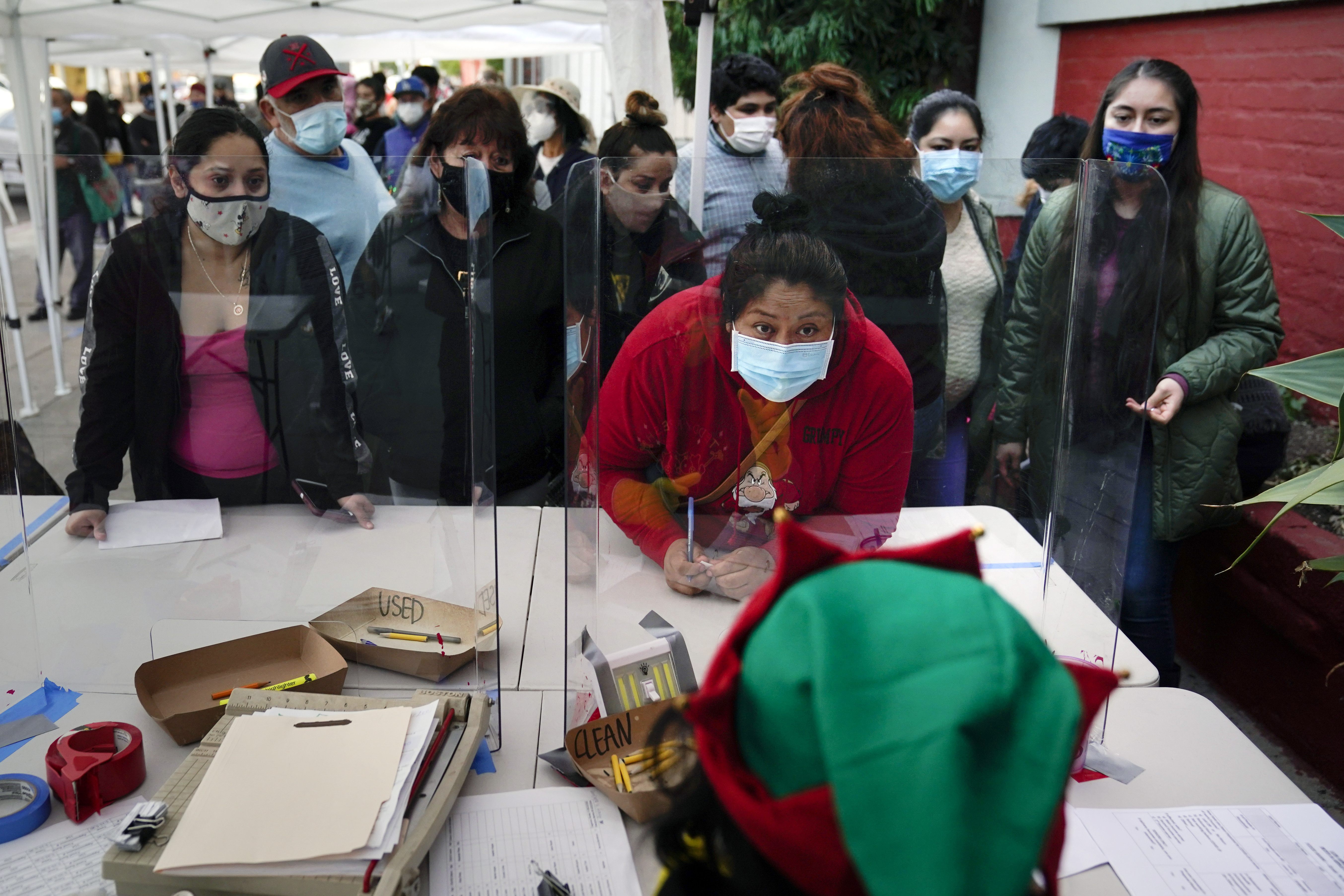 Long lines at food banks like this one at Los Angeles Boys & Girls Club in the Lincoln Heights neighbourhood of Los Angeles are still commonplace as millions of US families continue to struggle with job losses and reduced hours stemming from the pandemic