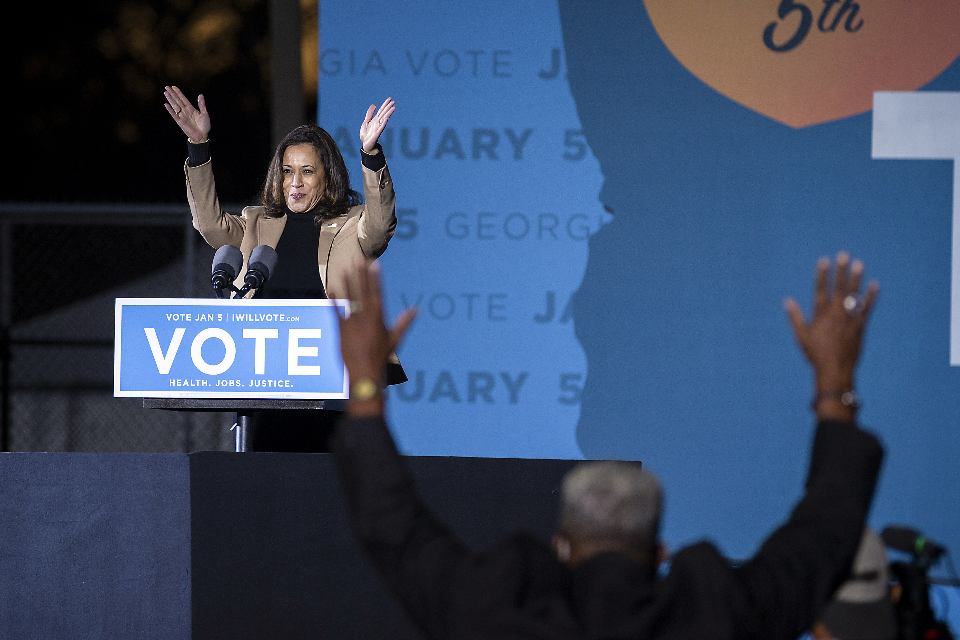 Vice President-elect Kamala Harris speaks at a drive-in rally during a campaign stop for Democratic Senate candidates the Reverend Raphael Warnock and Jon Ossoff