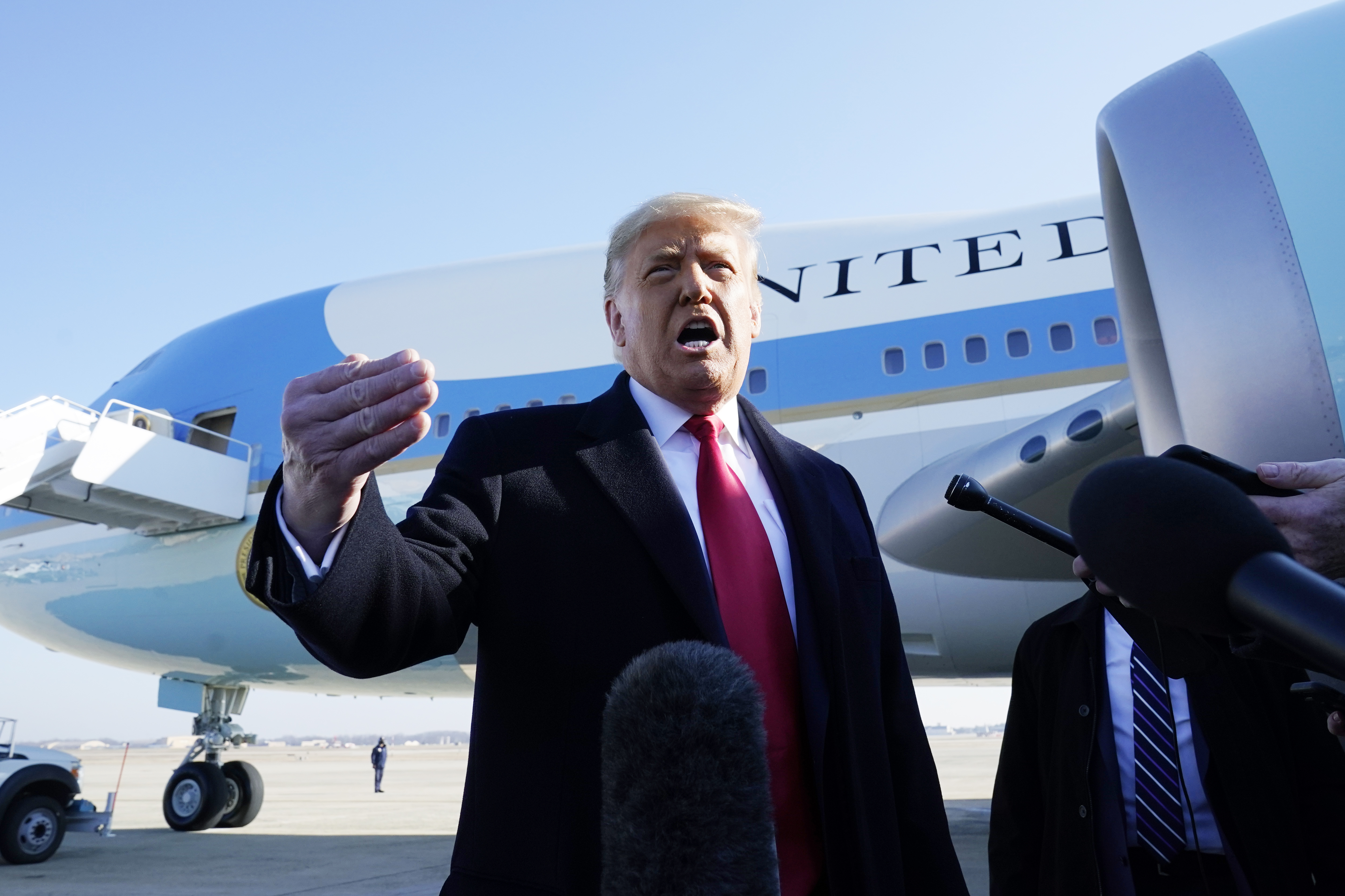 President Donald Trump speaks to the media before boarding Air Force One at Andrews Air Force Base