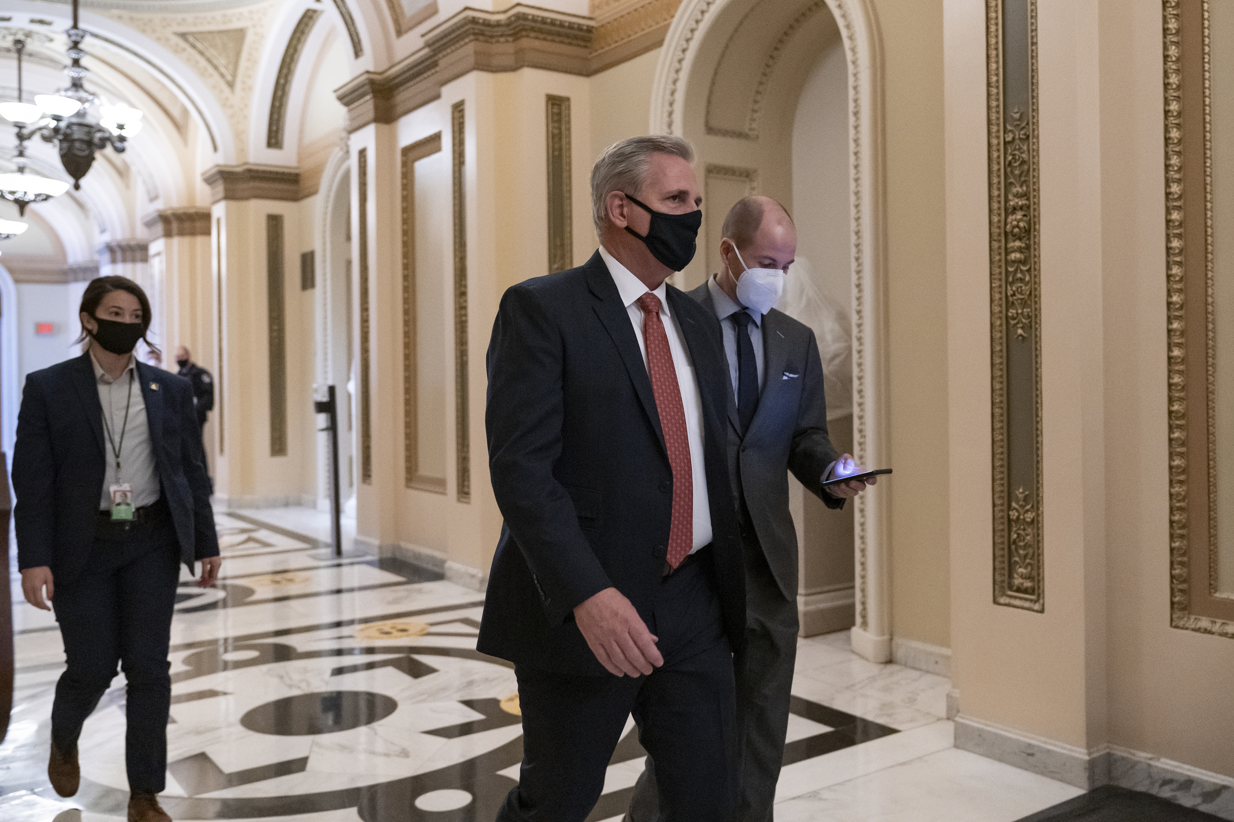 House Minority Leader Kevin McCarthy walks to the chamber at the Capitol in Washington