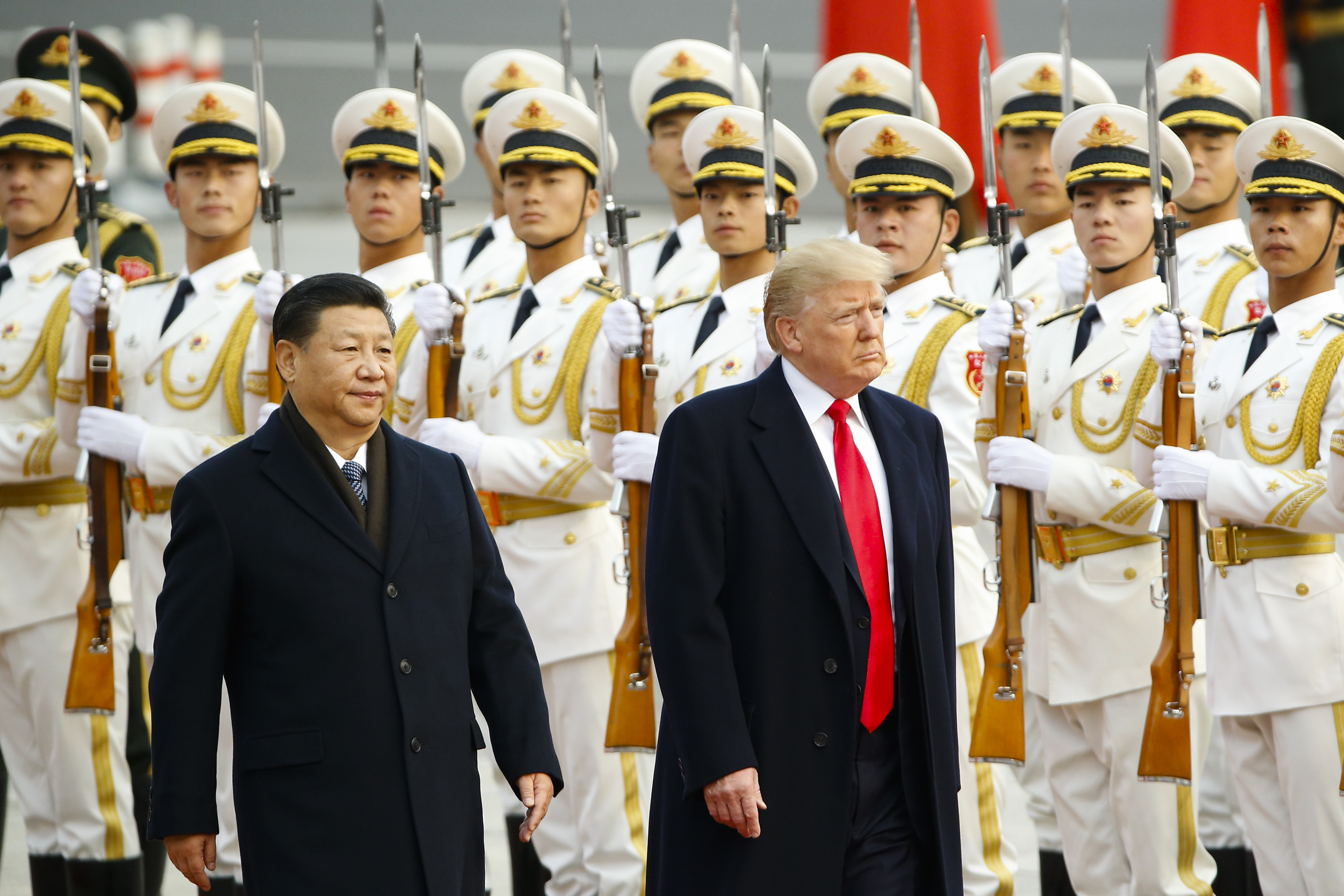 President Donald Trump takes part in a welcoming ceremony with China’s President Xi Jinping on November 9, 2017 in Beijing during a 10-day trip to Asia
