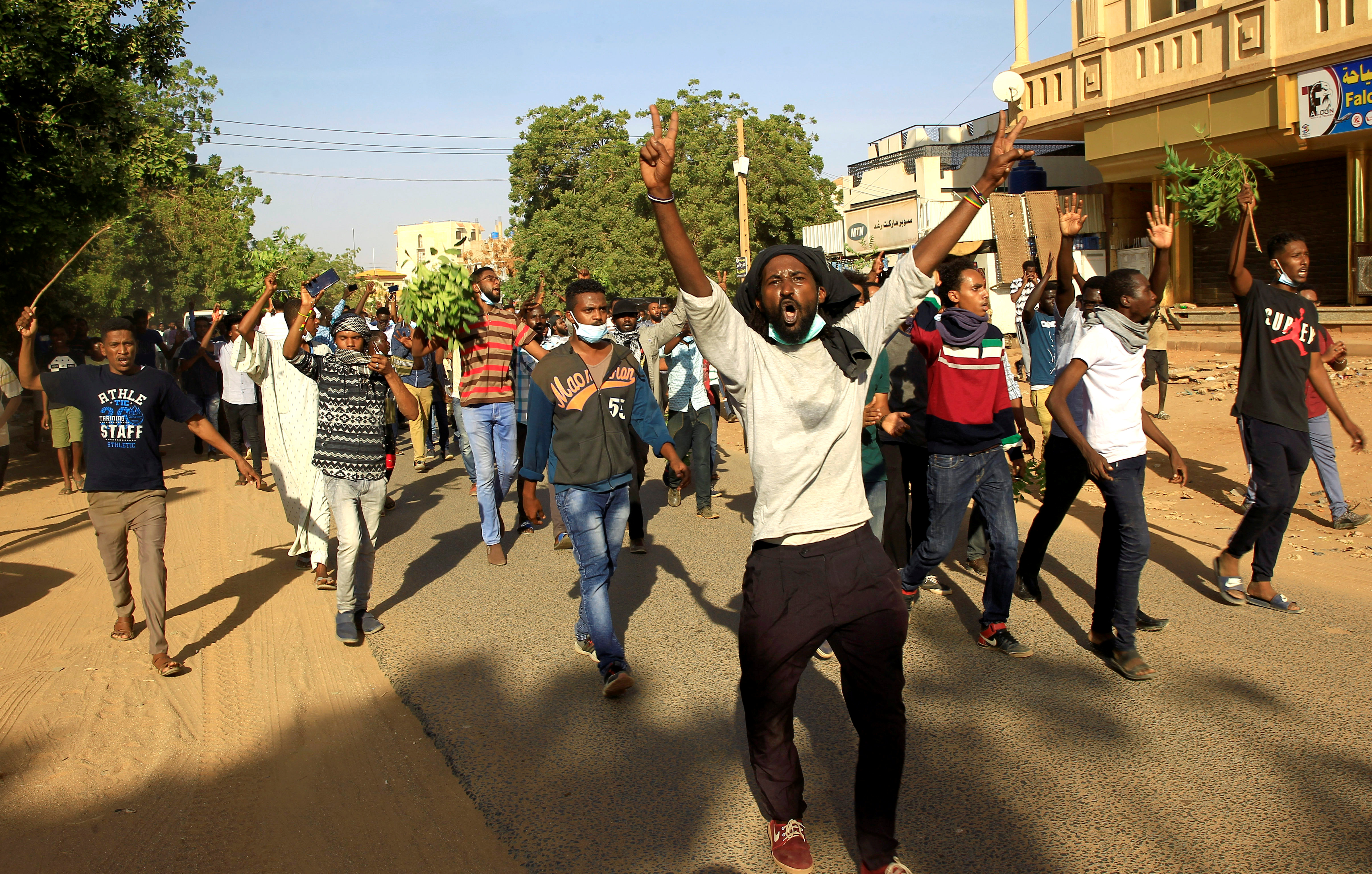 Demonstrators chant slogans as they march along the street during anti-government protests in Khartoum, Sudan in December 2018