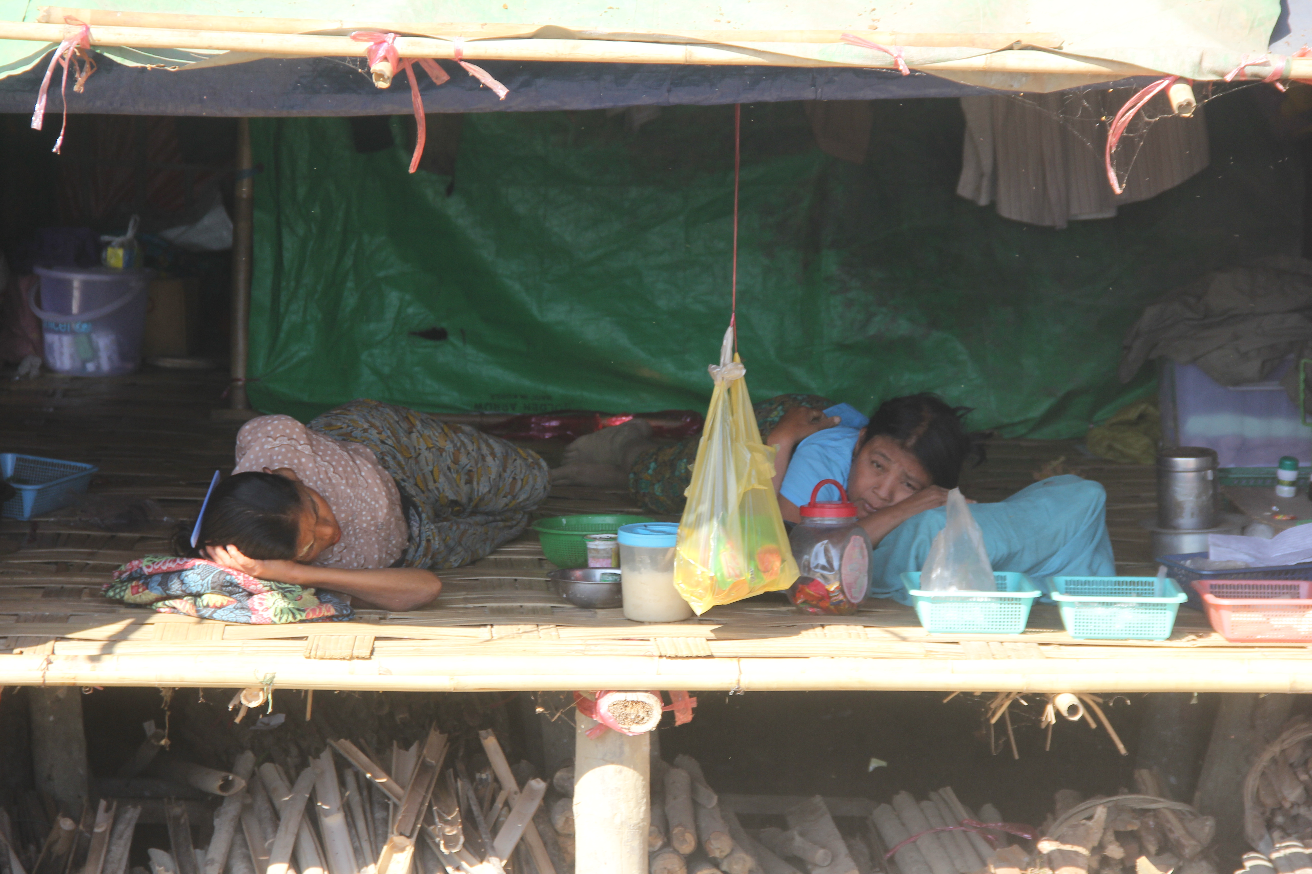 Women who were forced from their homes by fighting in Tinma have taken shelter in the railway station at Kyauktaw