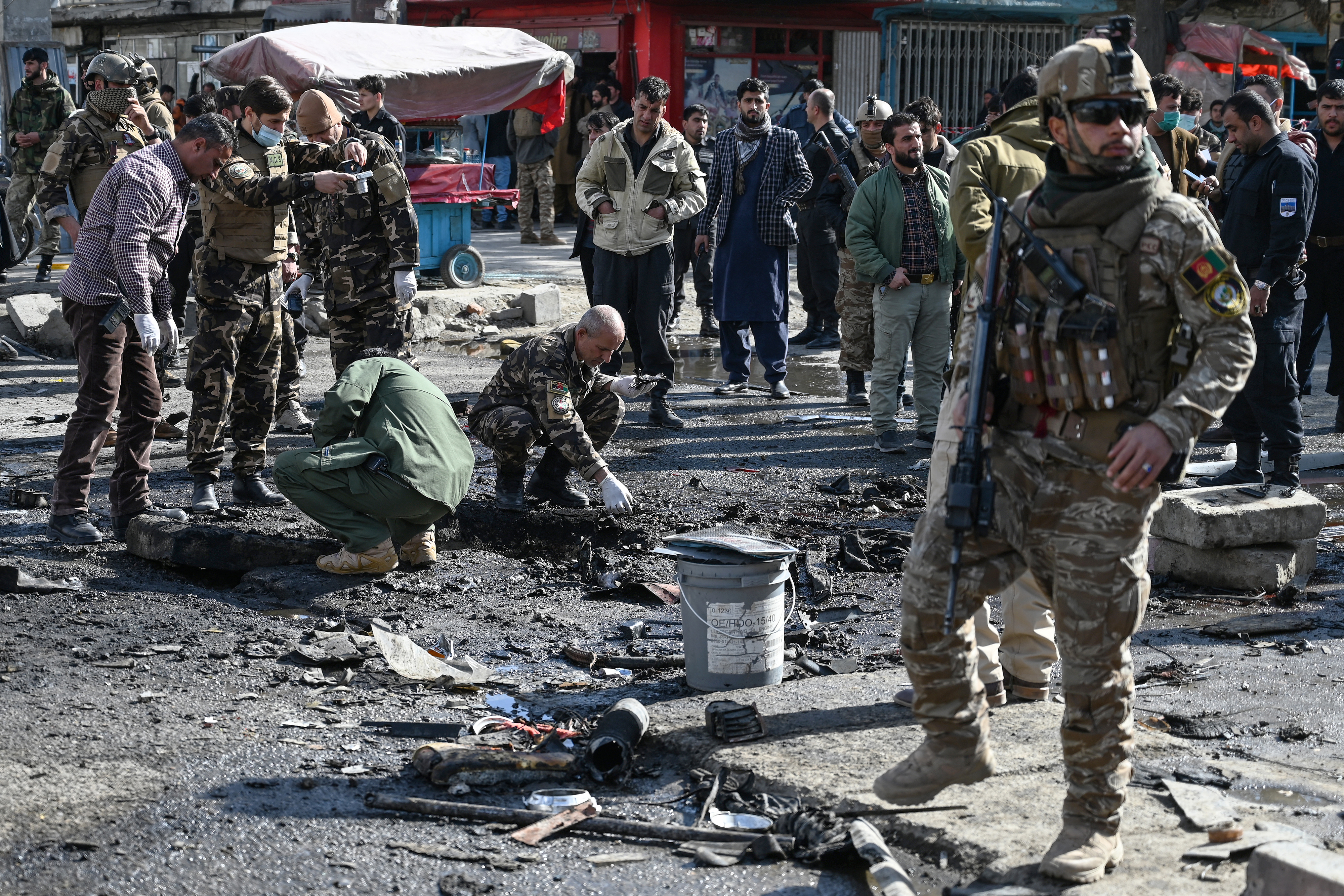 Security personnel at the site in Kabul after multiple bomb blasts killed at least two people