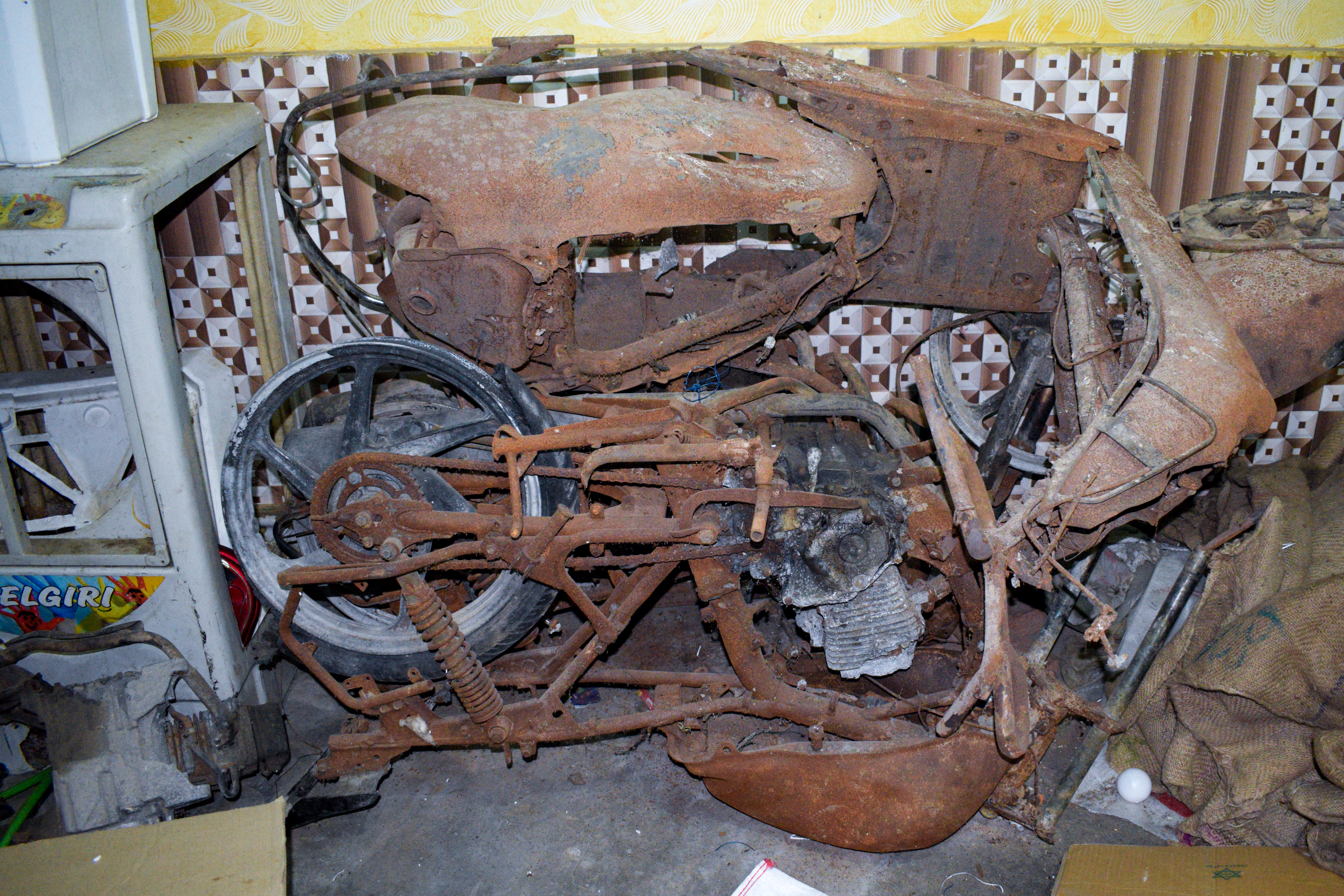 Remains of burnt motorbikes kept in a room in Shahnaz Shaikh’s house