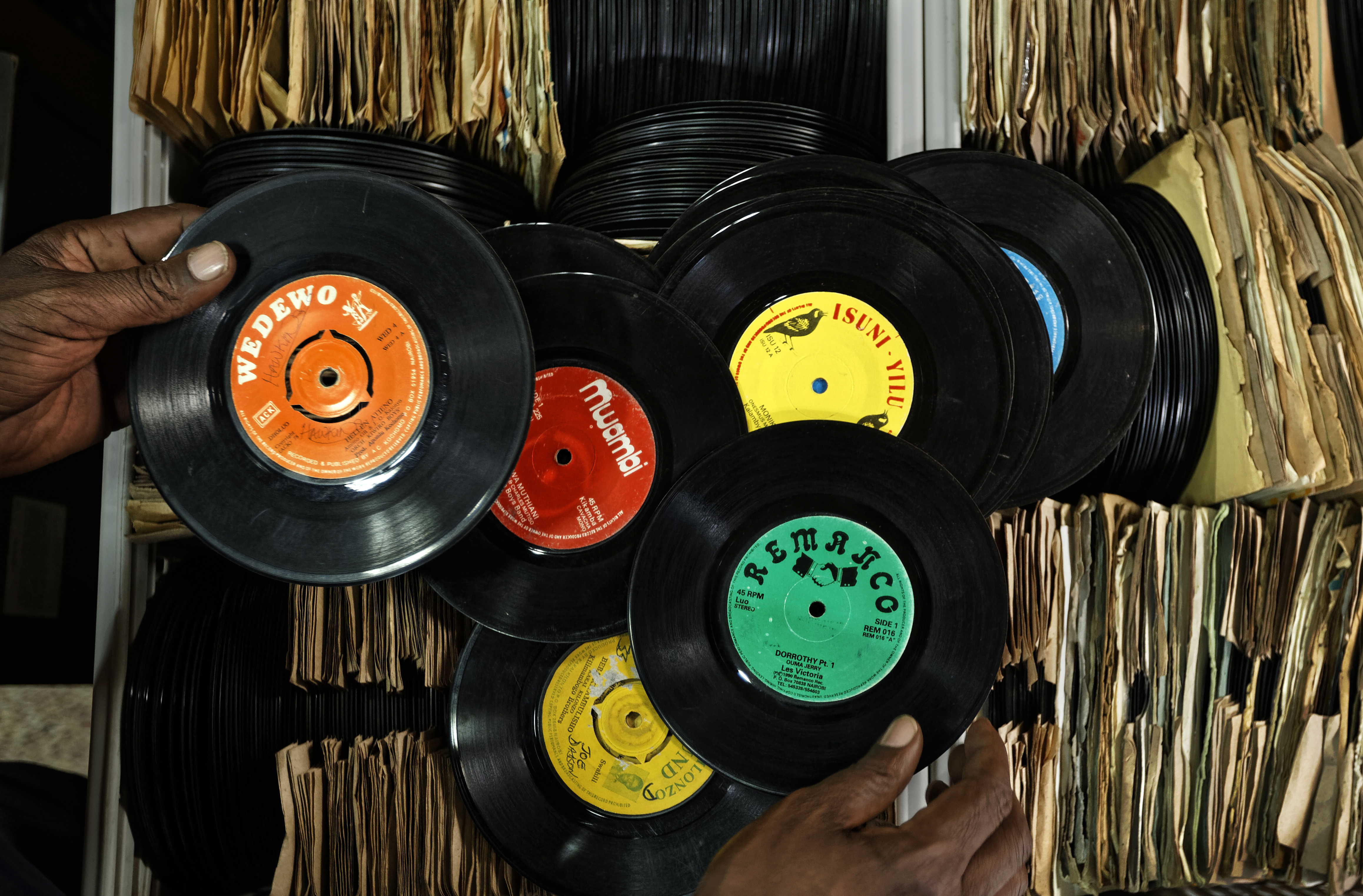 Vinyl records are experiencing a revival across the world, including in many African countries. In this photo taken in March 2018, a vendor sorts through records in his vinyl stall in Kenyatta Market in Nairobi, Kenya