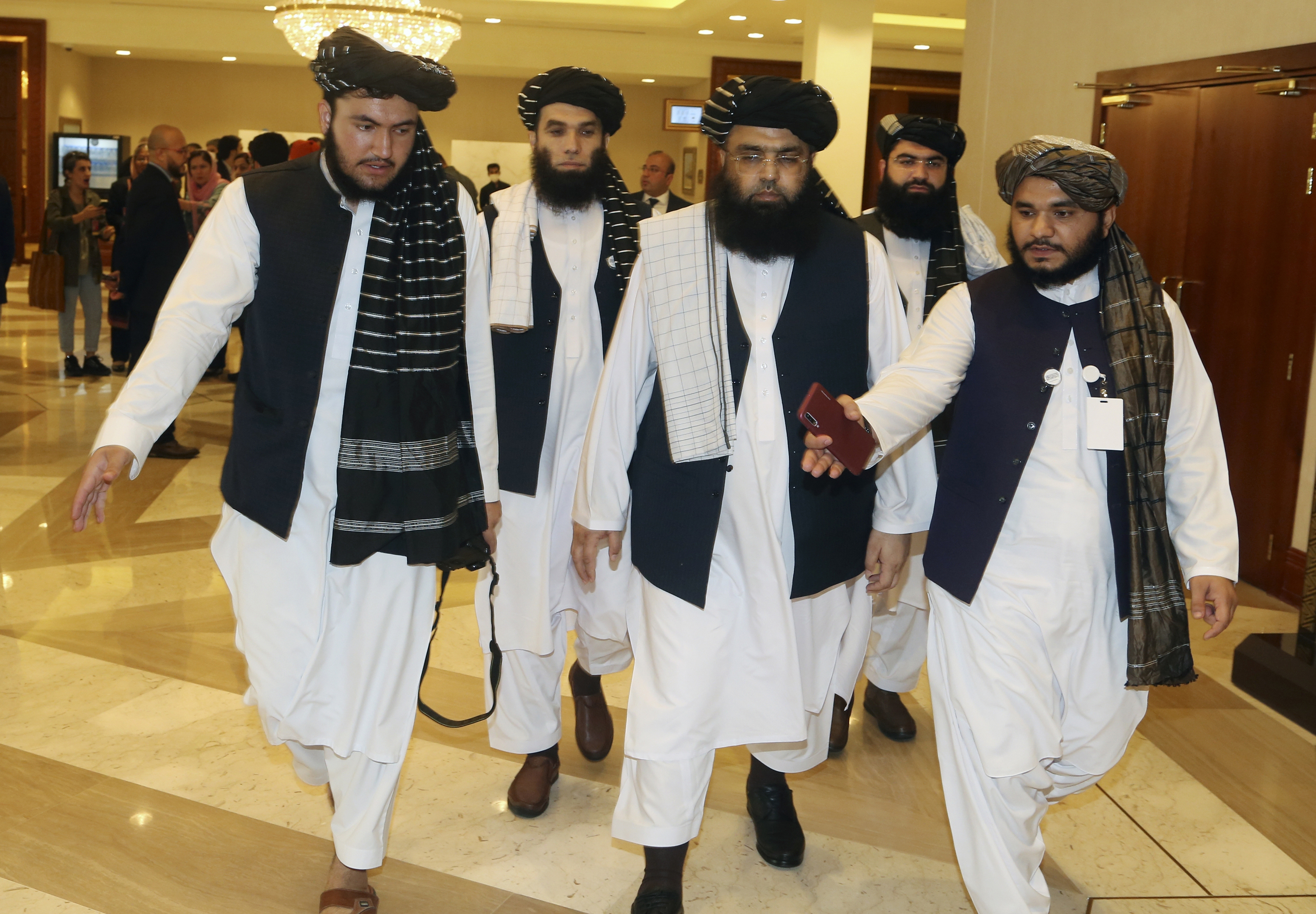 A few members of the Taliban delegation head to attend the opening session of the peace talks between the Afghan government and the Taliban in Doha, Qatar, Saturday, September 12, 2020
