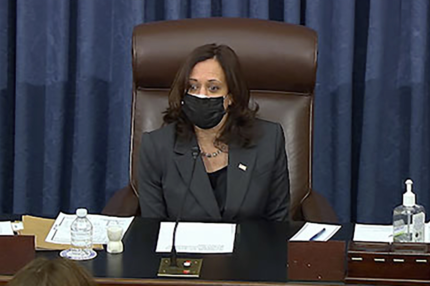 In this image from Senate TV, Vice President Kamala Harris sits in the chair on the Senate floor to cast the tie-breaking vote, her first, at the Capitol in Washington [Senate TV via AP Photo]