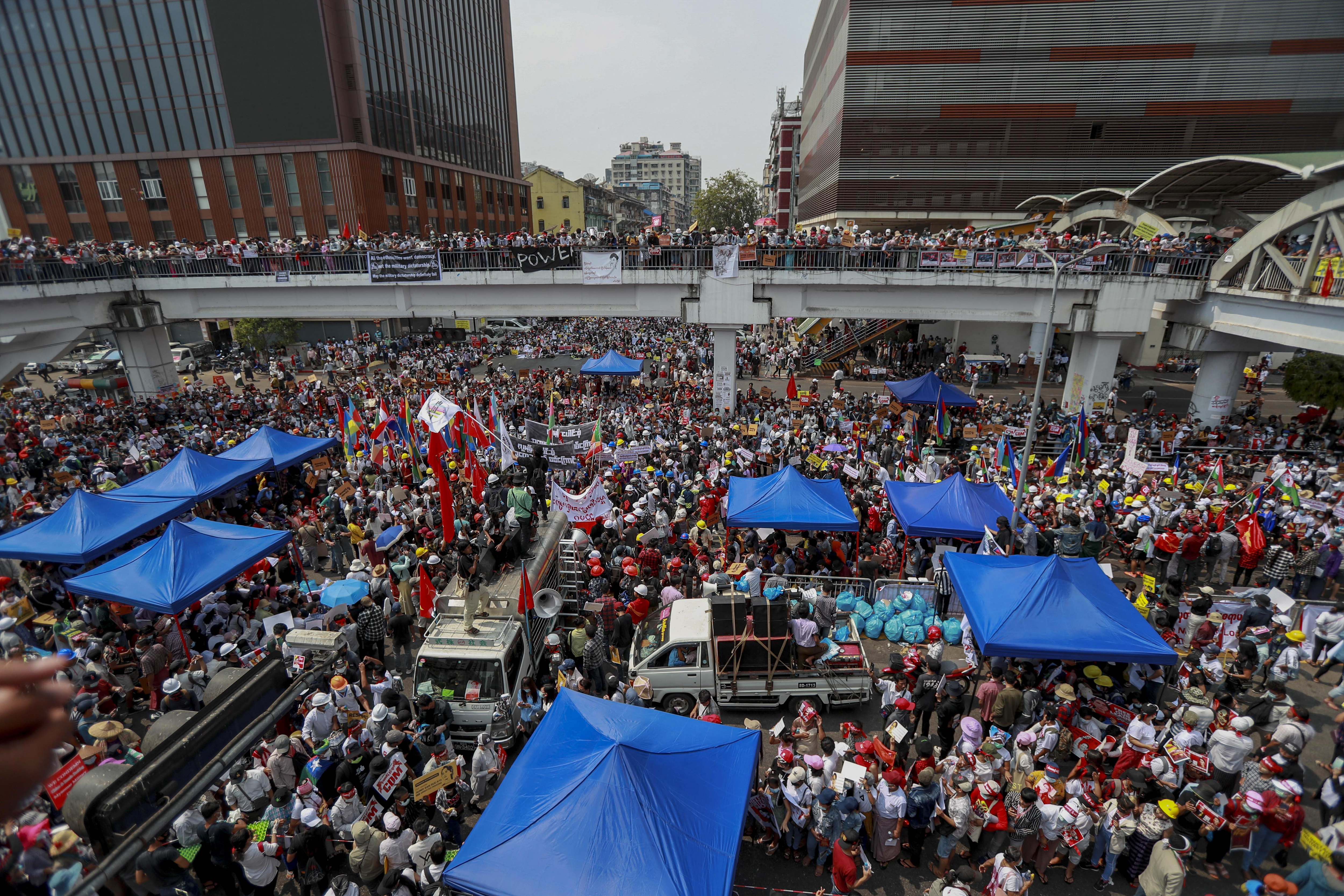 Demonstrators of different ethnic groups gather during a protest against the military coup in Yangon on Thursday [AP]