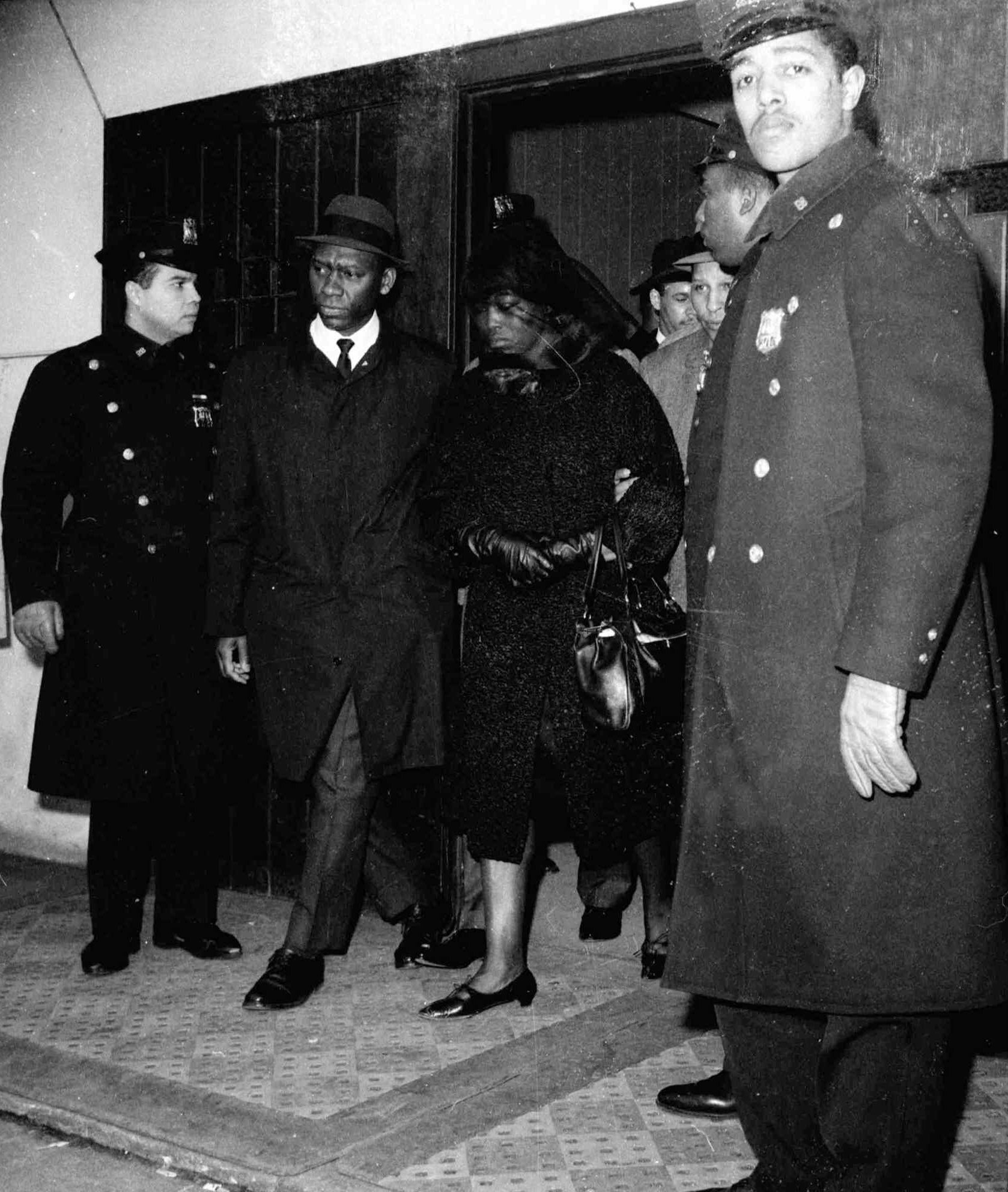 Malcolm X’s widow Betty leaves her husband’s funeral service in Harlem on February 27, 1965 [AP Photo]
