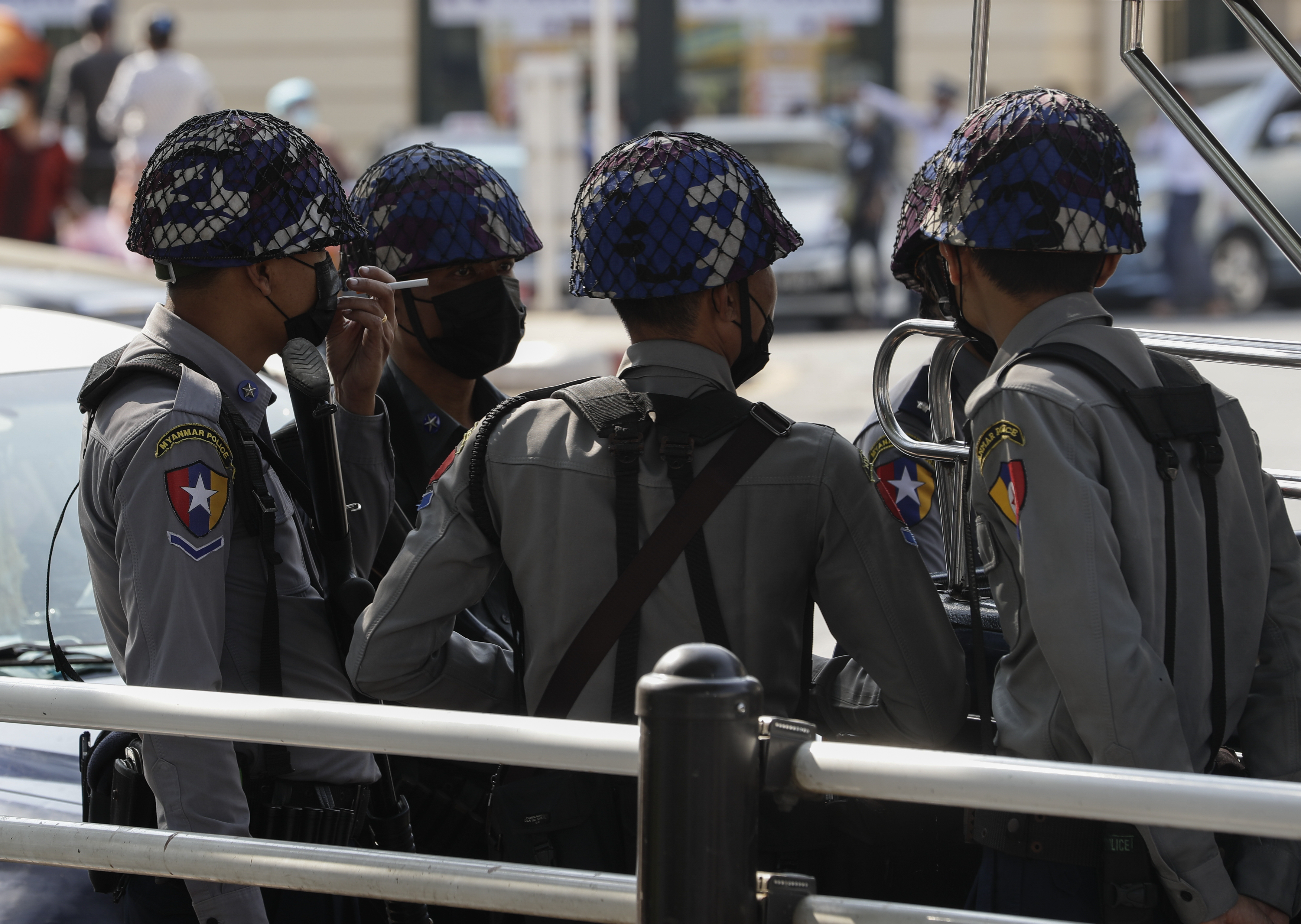 Policemen in the centre of Yangon as ordinary people staged acts of civil disobedience following Monday’s coup
