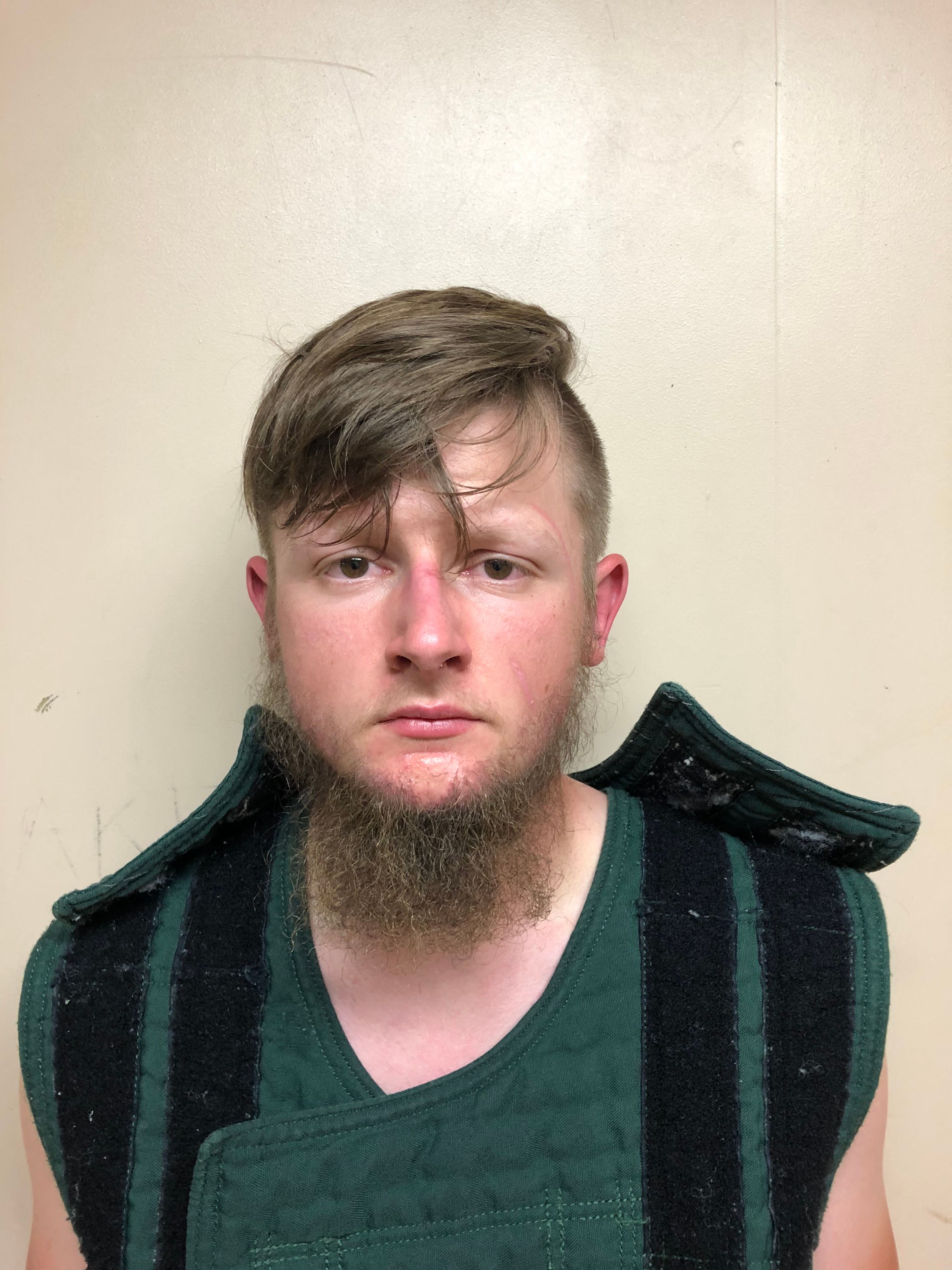 This handout booking photo released by the Crisp County Sheriff’s Office on March 16, 2021, shows 21-year-old shooting suspect Robert Aaron Long