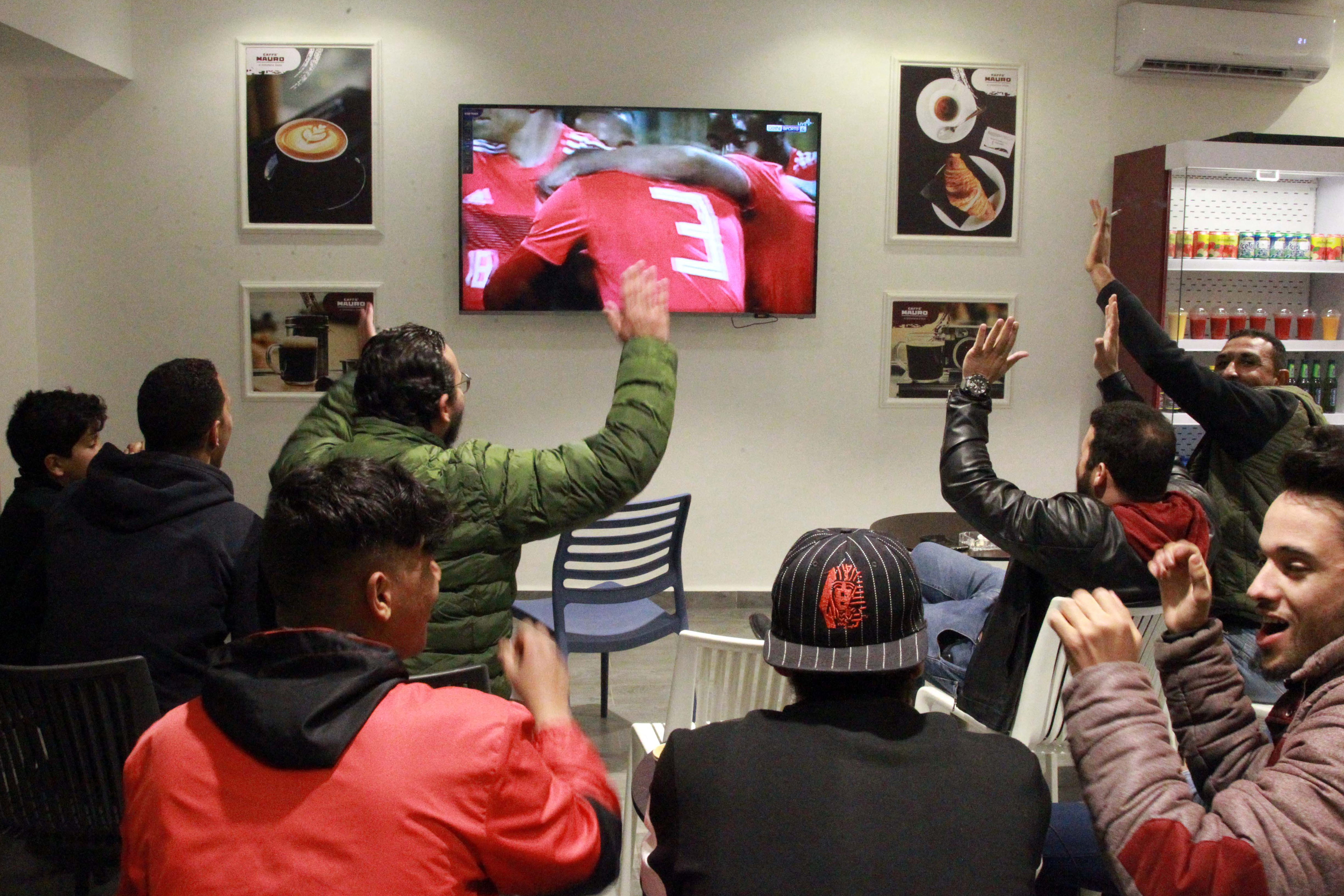 Libyans at a cafe in Benghazi celebrate their team’s opening goal against Tunisia