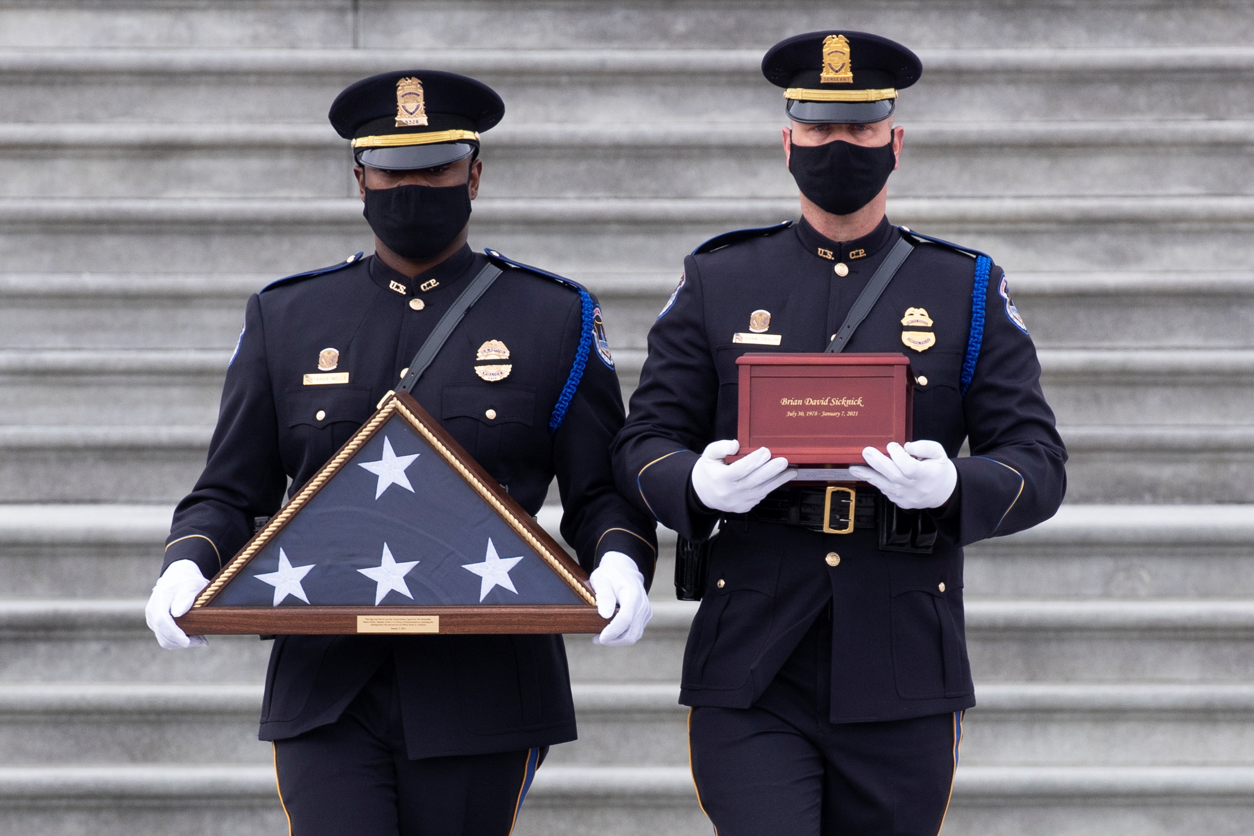 The remains of Capitol Police officer Brian Sicknick are carried down the East Front steps after ‘lying in honour’ in the Rotunda of the Capitol in Washington, DC on February 3, 2021