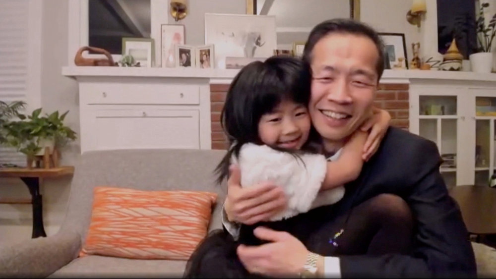 Lee Isaac Chung, winner of the best foreign-language film for Minari, with his daughter [NBC Handout via Reuters]