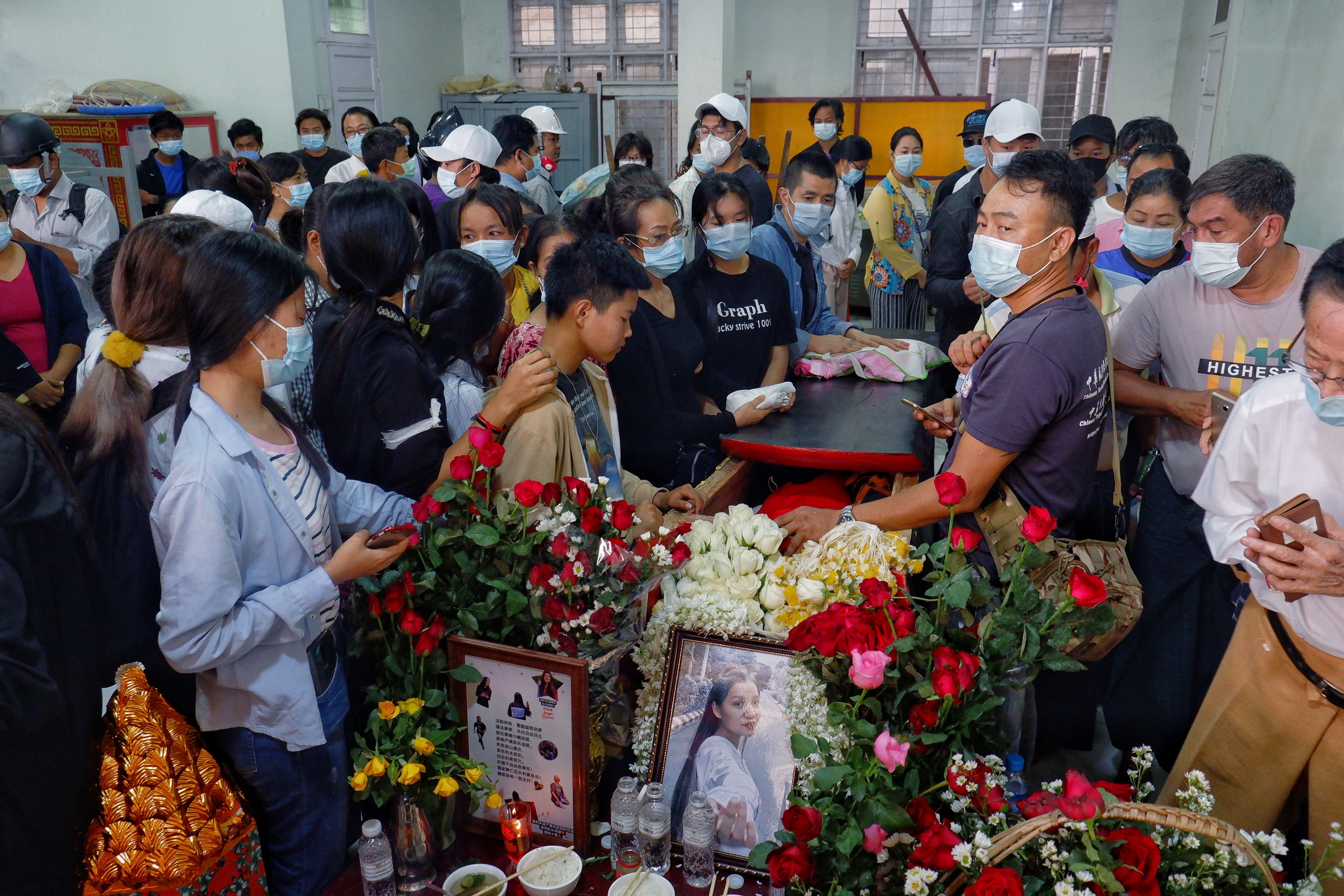 People attend the funeral of 19-year-old Ma Kyal Sin who was shot in the head as Mynamar forces opened fire to disperse an an anti-coup demonstration in Mandalay, Myanmar March 4, 2021