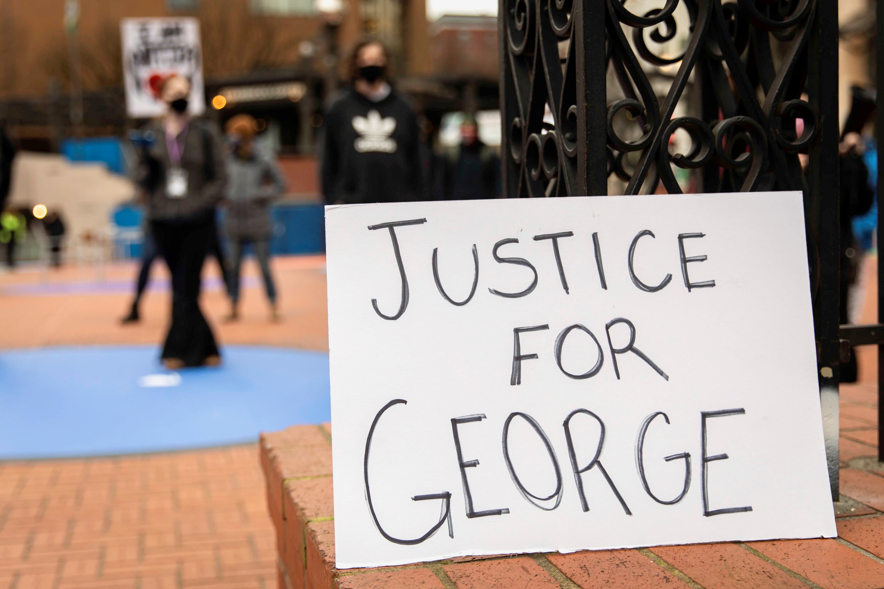A 'justice for George' sign is displayed during a march in Portland, Oregon, last month [File: Maranie Staab/Reuters]