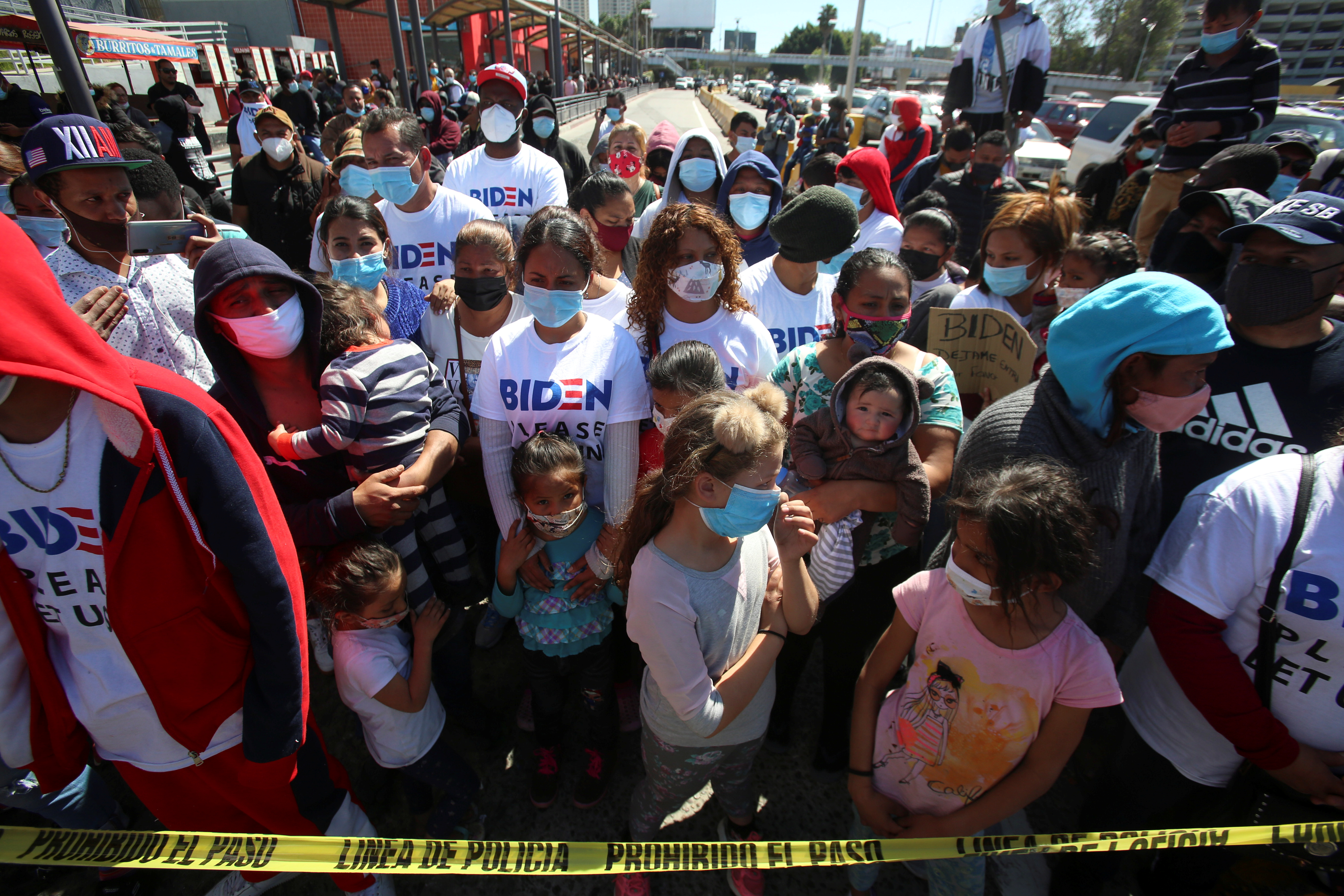Migrants holding a protest at the Mexico-US San Ysidro port of entry in Tijuana, Mexico March 2, 2021