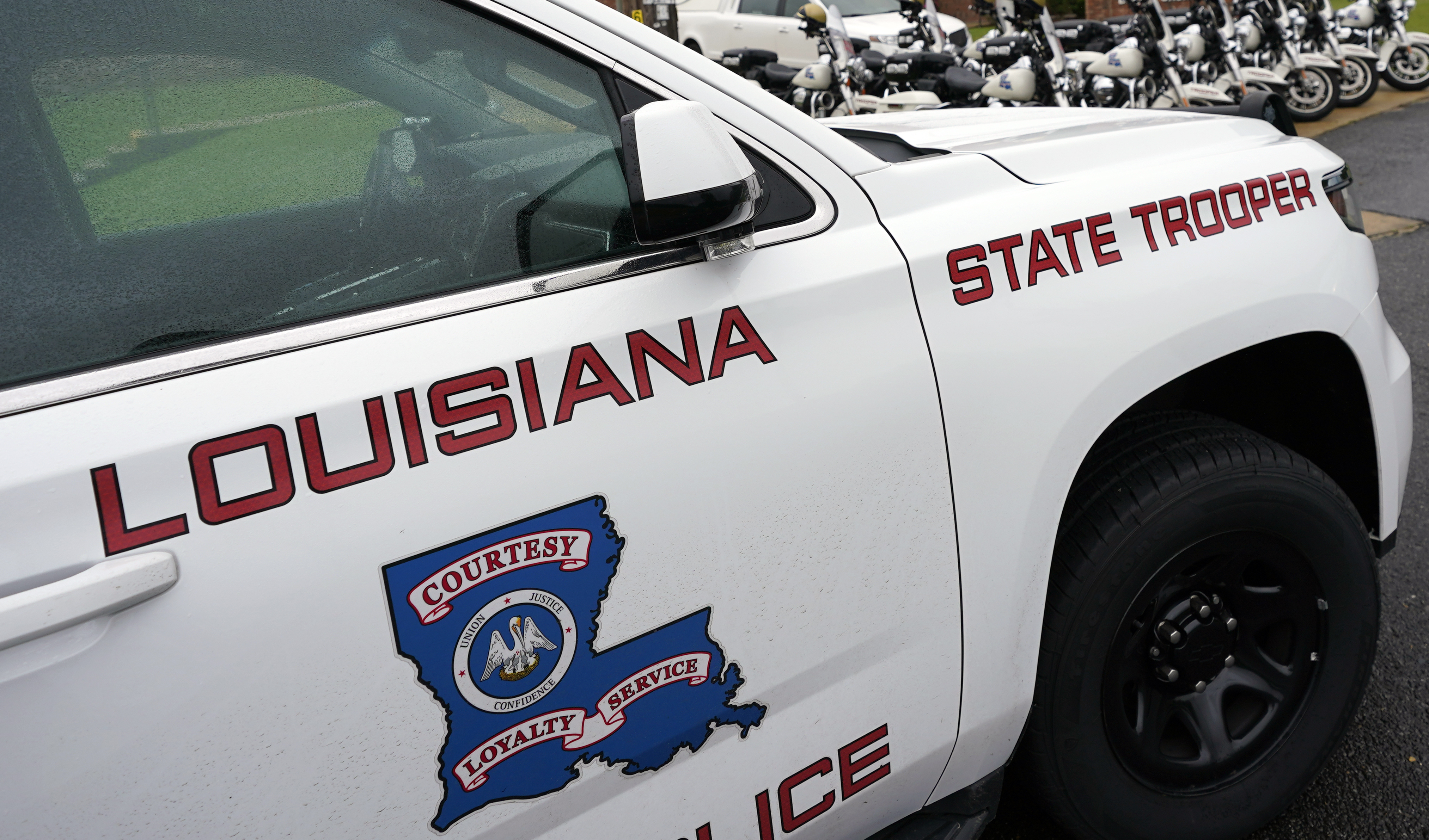 FILE - This Sept. 25, 2020, file photo, shows a Louisiana State Police vehicle in Louisiana. On Monday, Feb. 8, 2021, four Louisiana State Police troopers were arrested on charges of using excessive force, deactivating their body-worn cameras and making false statements about two arrests in 2019 and 2020. (AP Photo/Rogelio V. Solis, File)