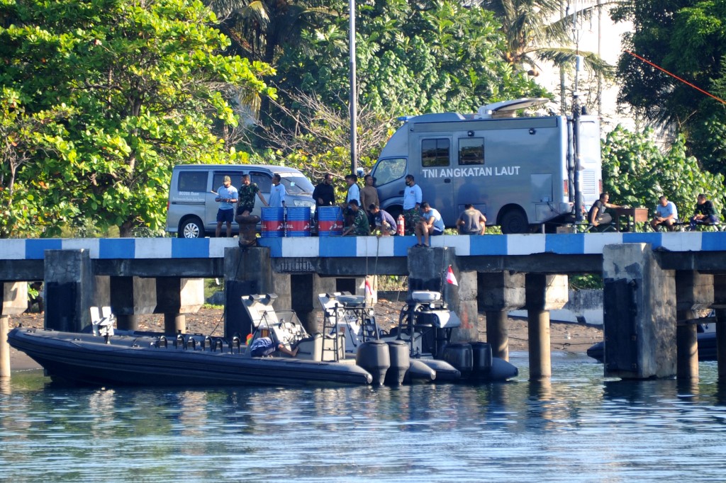 Indonesian navy personnel are seen at the naval base in Banyuwangi, East Java province on Saturday as the military continues with search operations off the coast of Bali for the missing submarine