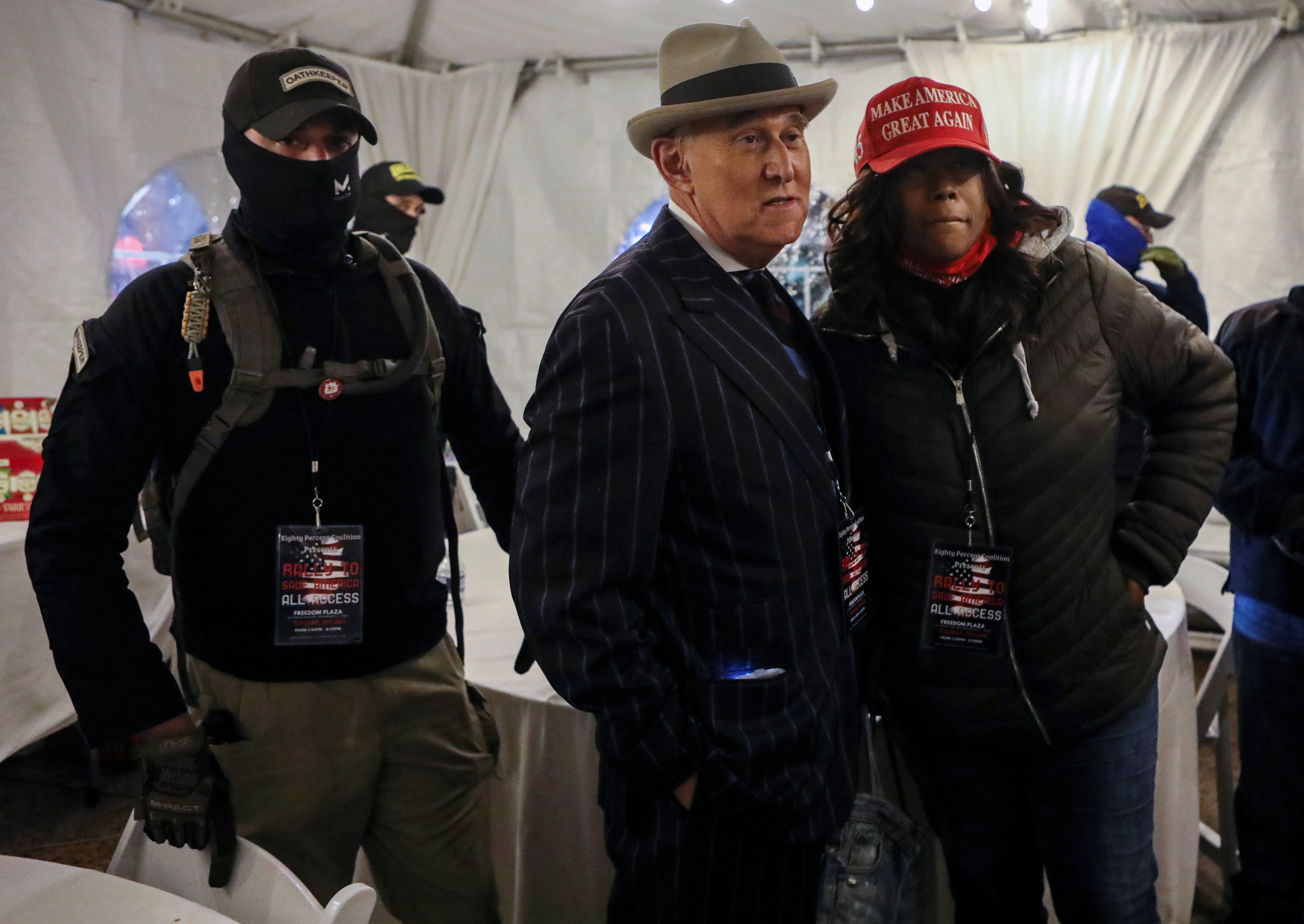 Members of the Oath Keepers provide security to Roger Stone at a rally the night before groups attacked the US Capitol, in Washington, DC, on January 5, 2021