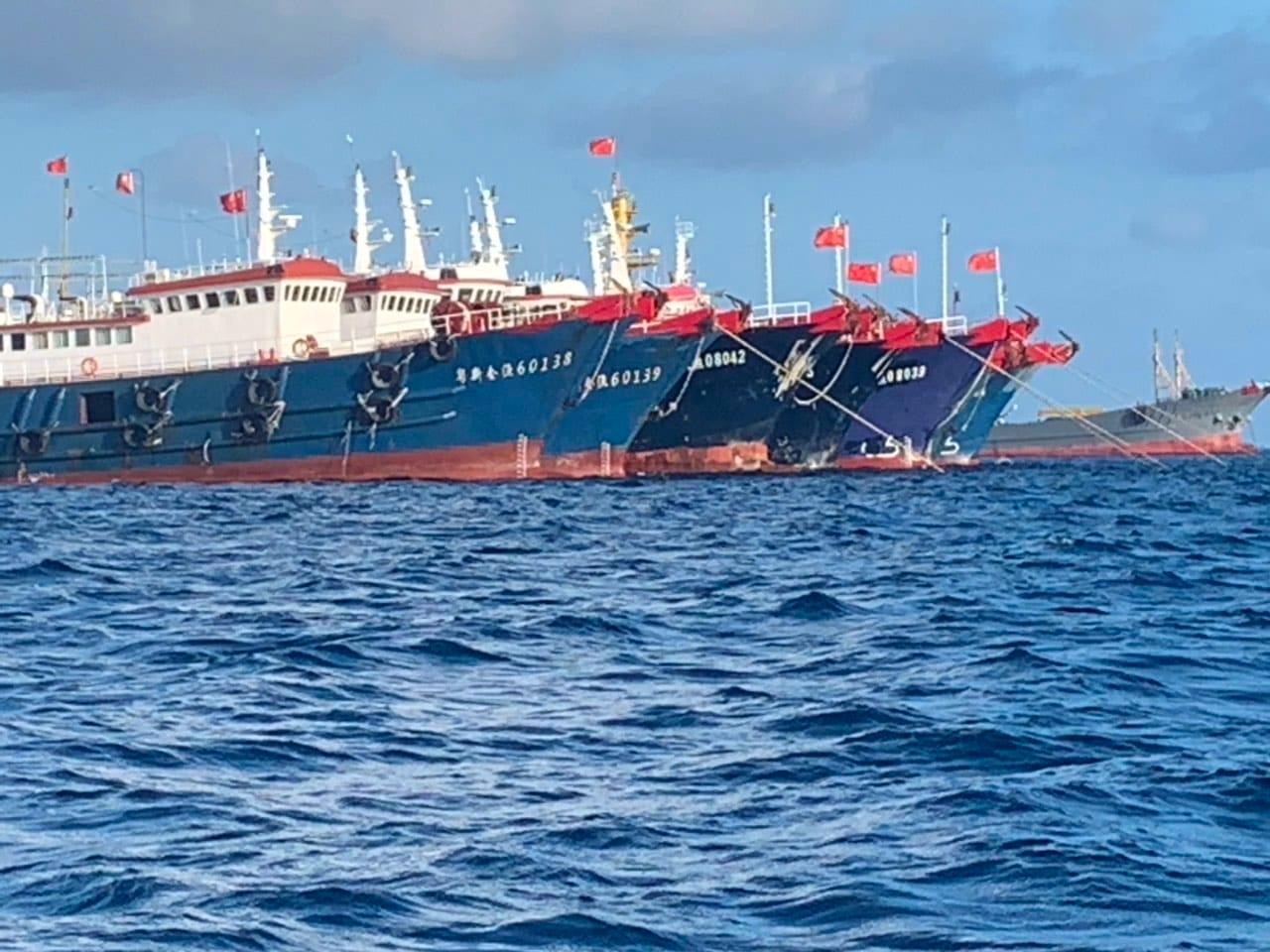 Chinese vessels, believed to be manned by Chinese maritime militia personnel, are seen at Whitsun Reef, South China Sea on March 27, 2021. Picture taken March 27, 2021. Philippine Coast Guard/National Task Force-West Philippine Sea/Handout via REUTERS THIS IMAGE HAS BEEN SUPPLIED BY A THIRD PARTY. NO RESALES. NO ARCHIVES.