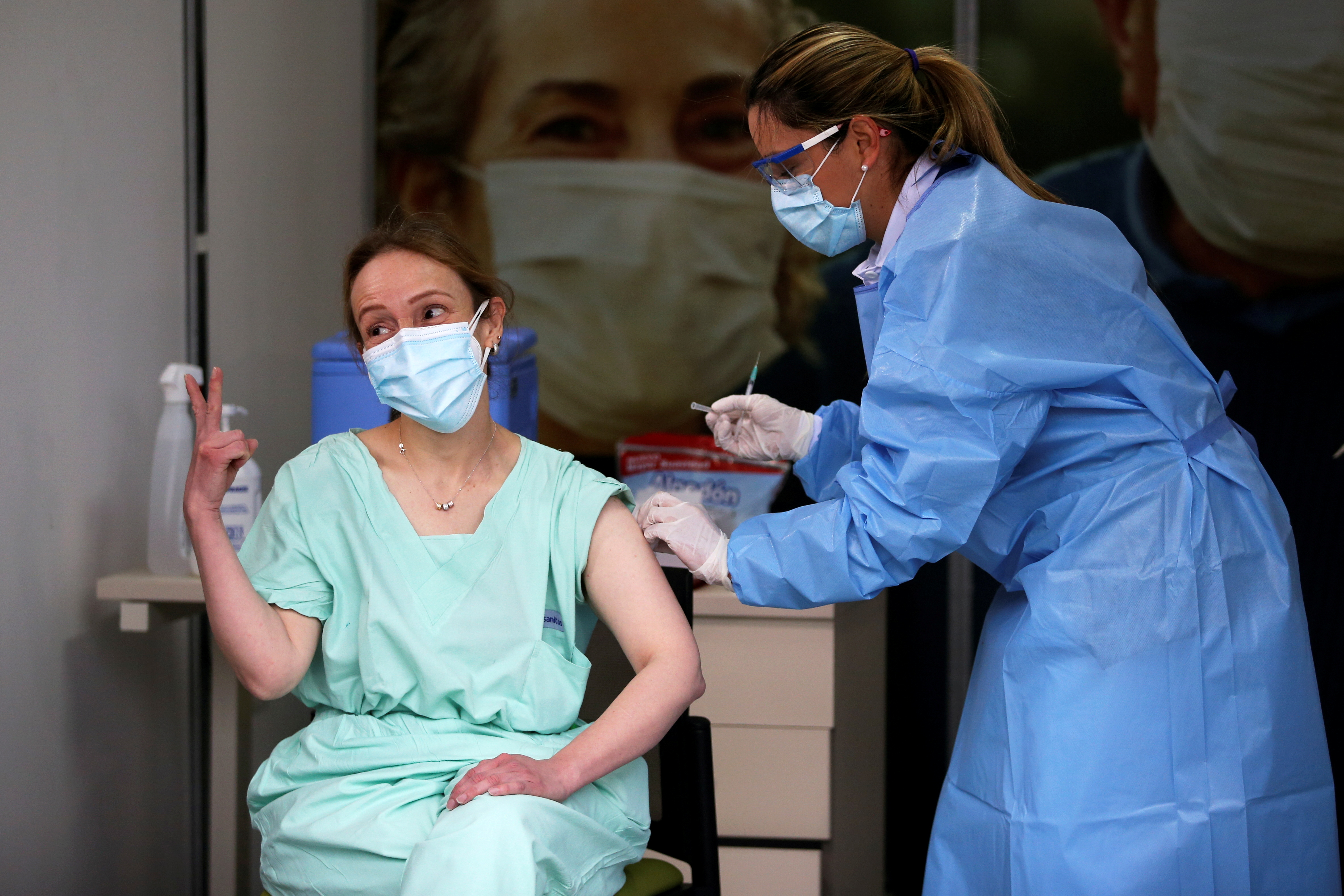 An emergency doctor at a clinic in Colombia receiving an injection of the Pfizer COVID-19 vaccine in Bogota, Colombia