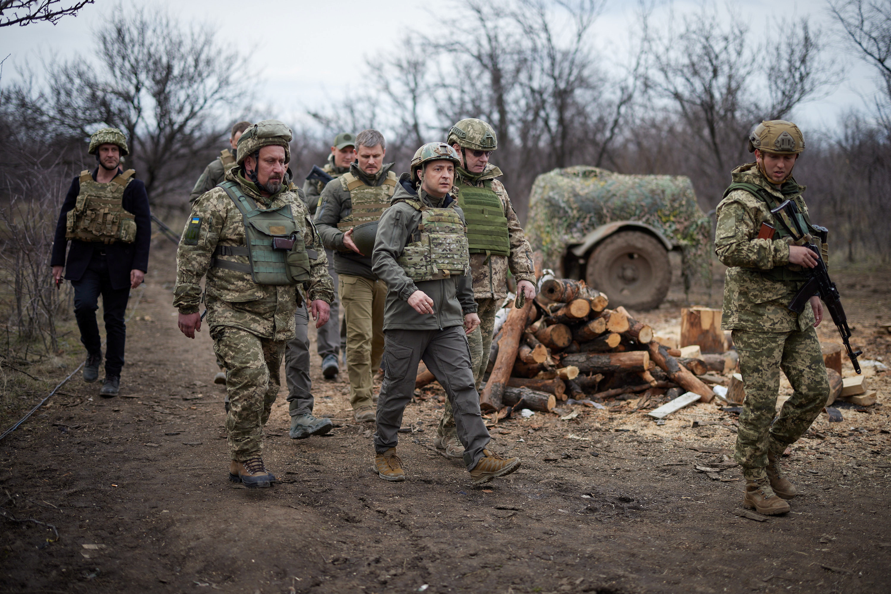 Ukraine’s President Volodymyr Zelenskiy visits positions of armed forces near the frontline in Donbas [Handout via Reuters]