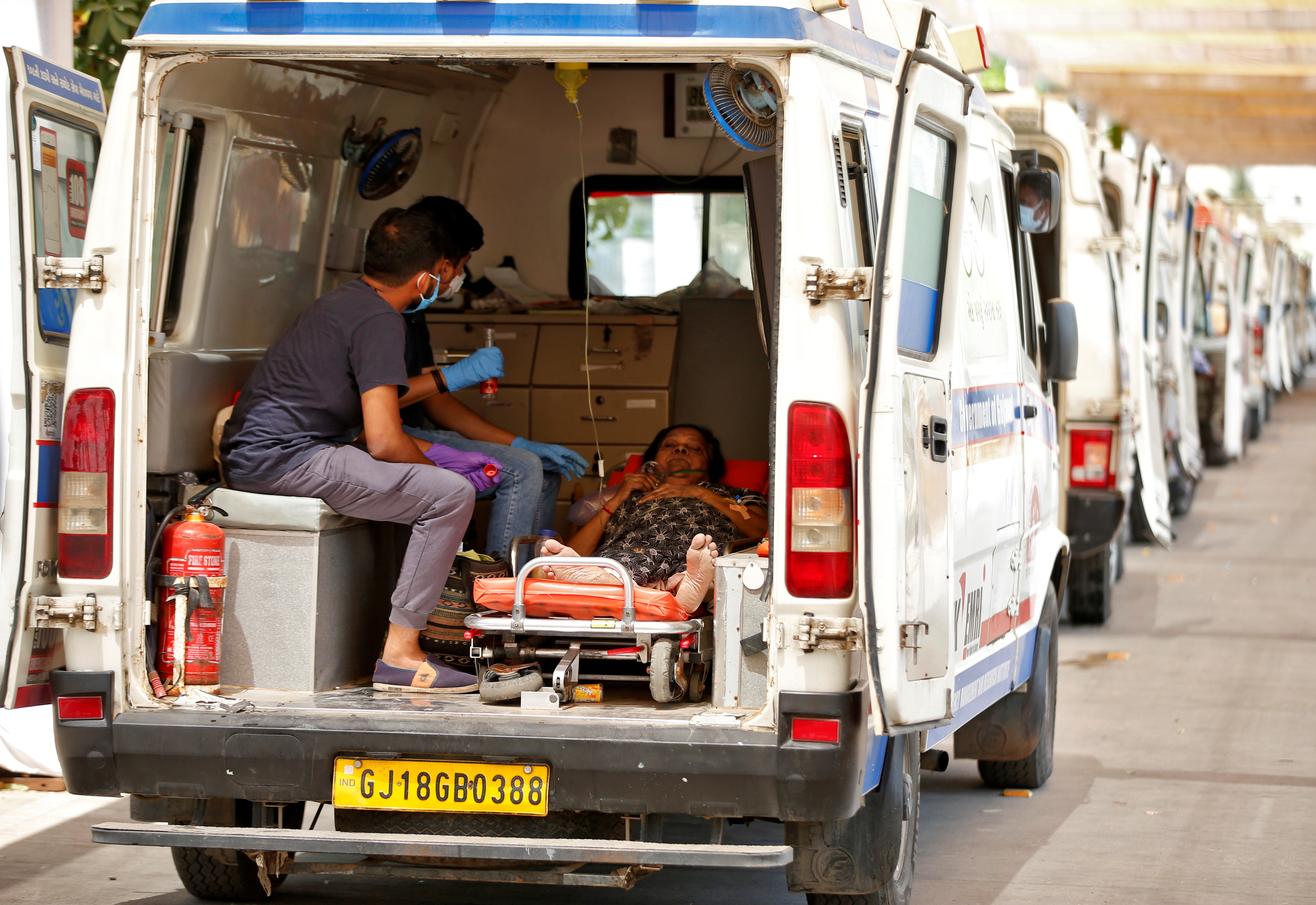 A woman waits inside an ambulance for her turn to enter a COVID-19 hospital for treatment, amid the spread of the coronavirus, in Ahmedabad, India, on April 28, 2021
