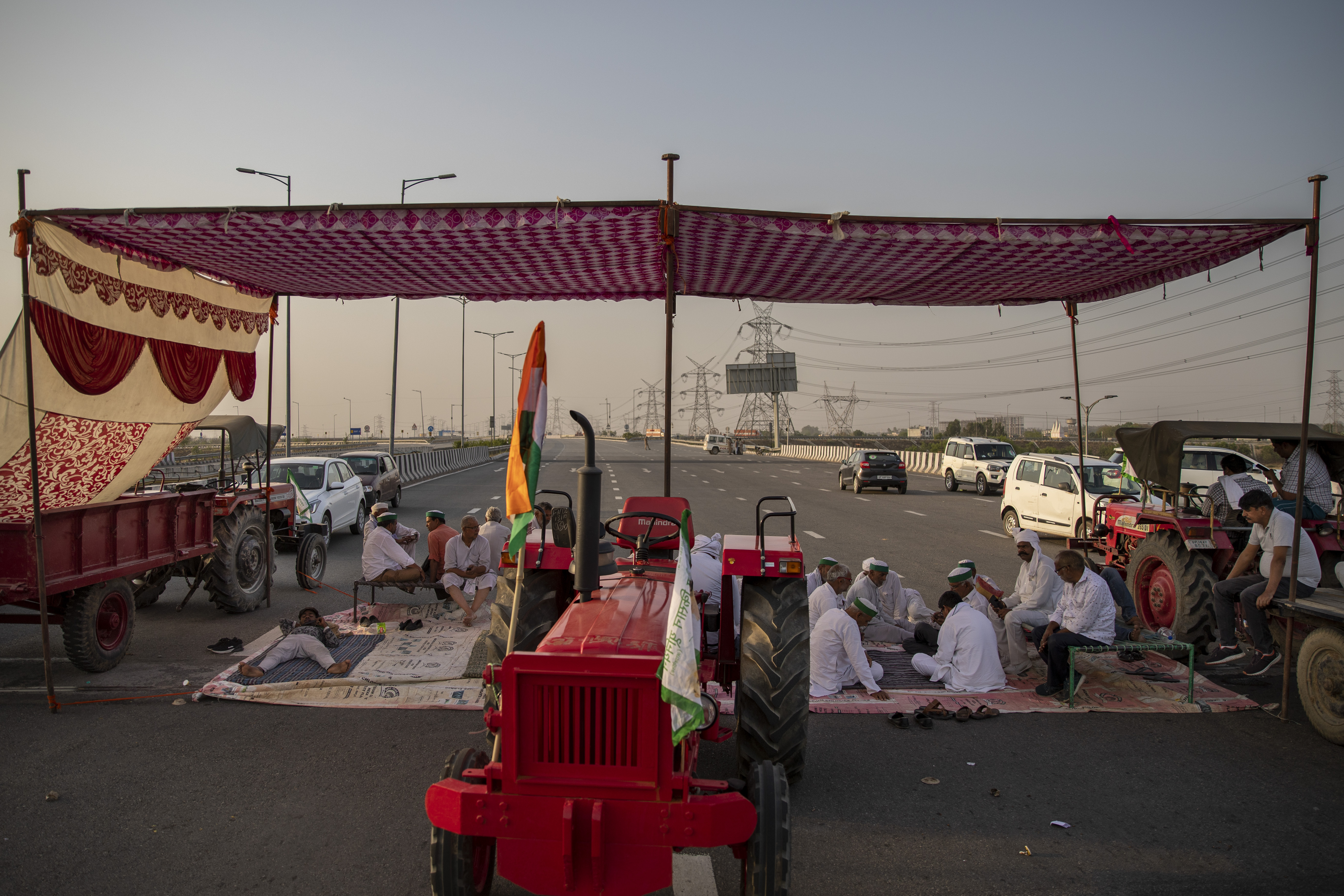 Farmers participate in a 24-hour blockade of a major expressway as part of their ongoing protests against new farm laws in Dasna, India