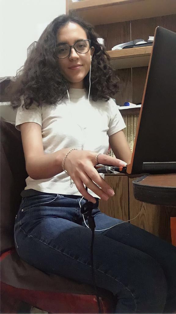 Andrea Olmos at her desk in her home in Mexico City, where she is completing university studies in administration
