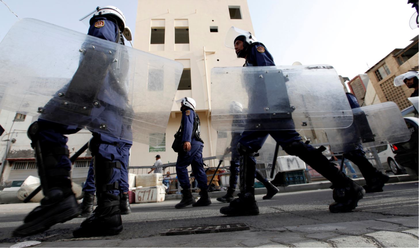 FILE PHOTO: Riot police patrol streets near British embassy prior to anti-government protest in support of Bahraini human rights activist Abdulhadi al-Khawaja in Manama