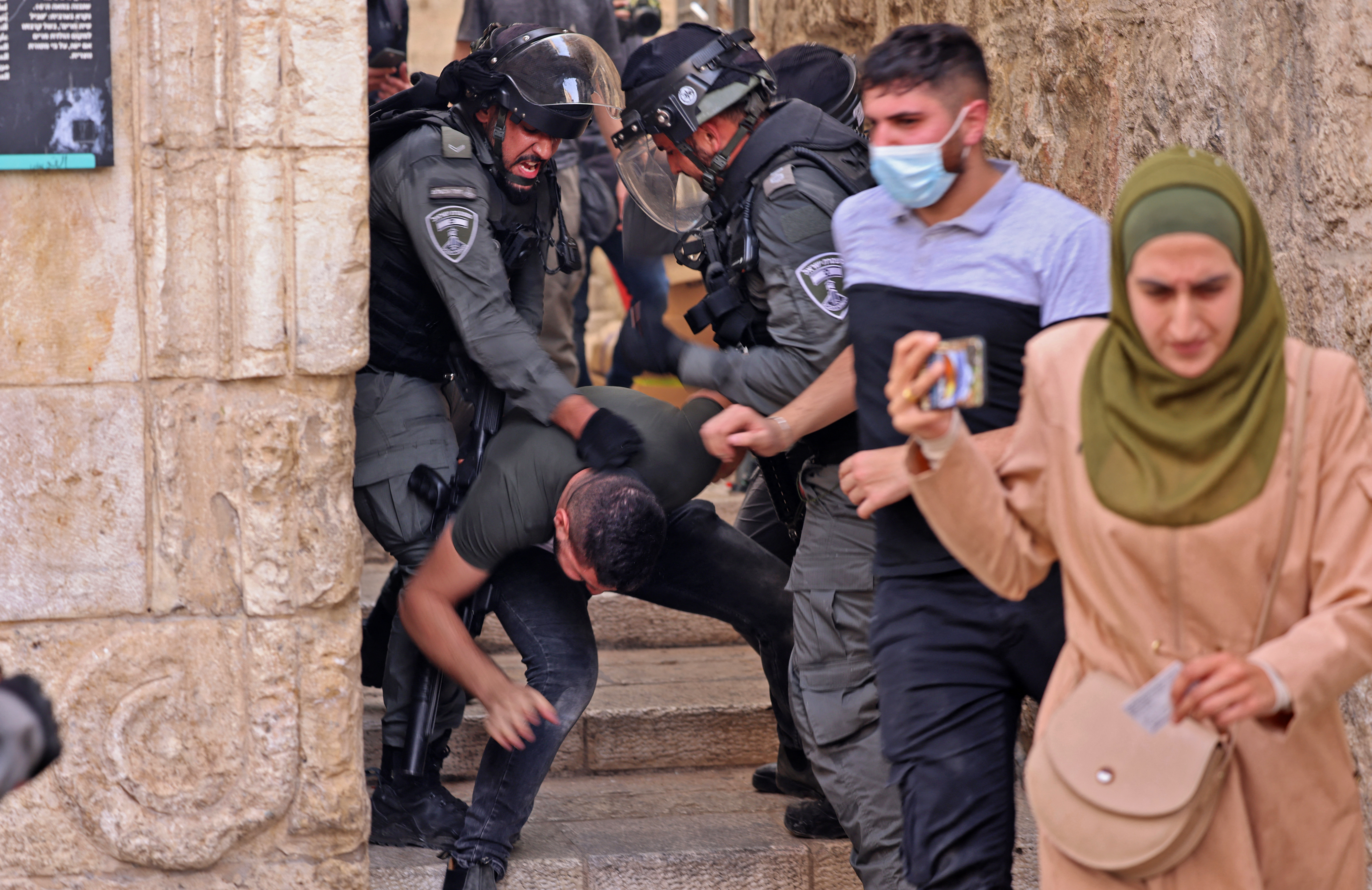 Israeli security forces detain a Palestinian protester by the Damascus Gate in Jerusalem’s Old City on May 10, 2021