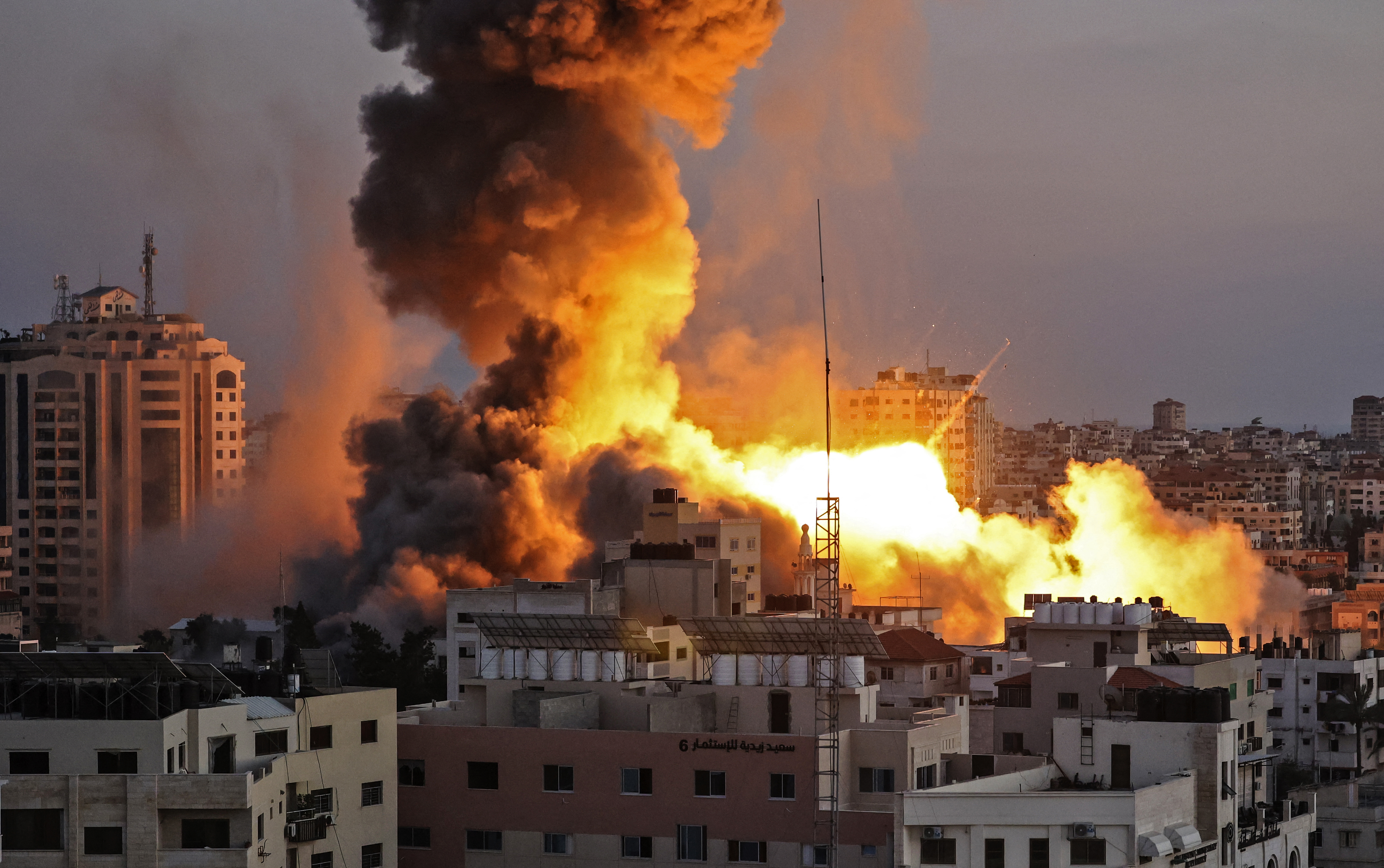 Smoke billows after an Israeli air raid on Gaza City targeted the Ansar compound, linked to the Hamas movement, in the Gaza Strip