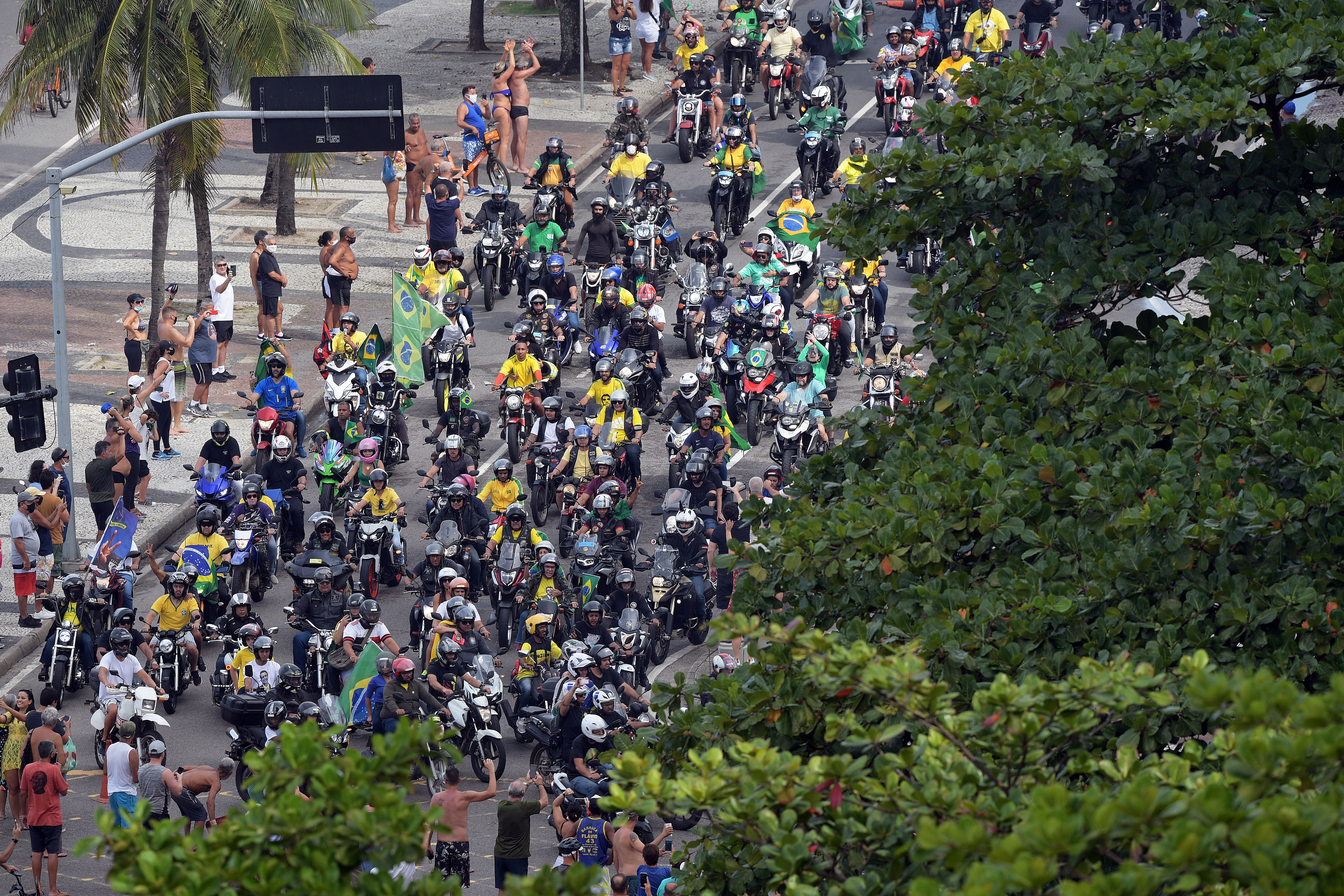 Supporters of Brazilian President Jair Bolsonaro take part in a motorcycle rally along Copacabana Beach