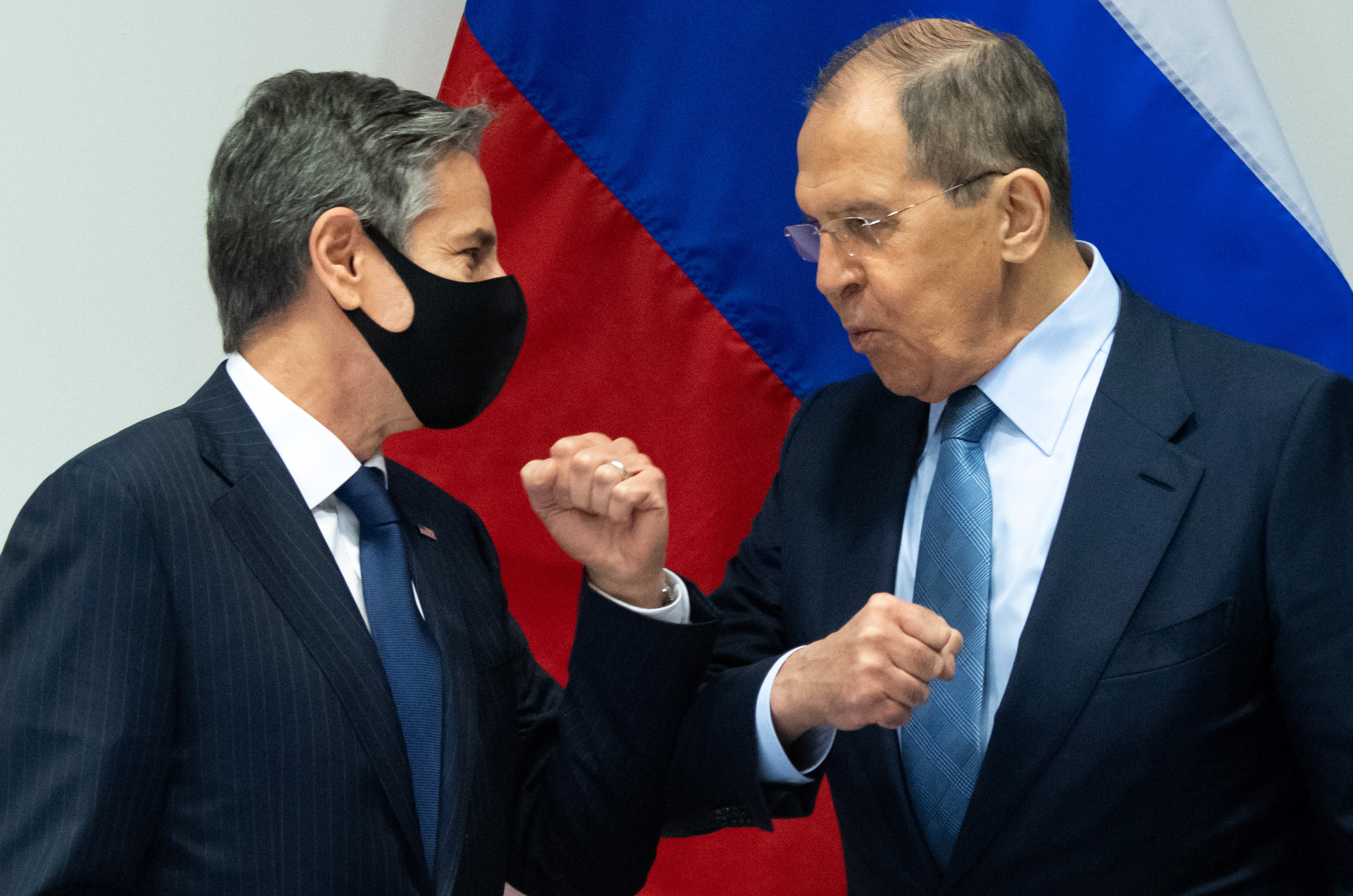 U.S. Secretary of State Antony Blinken greets Russian Foreign Minister Sergey Lavrov as they arrive for a meeting at the Harpa Concert Hall, on the sidelines of the Arctic Council Ministerial summit, in Reykjavik, Iceland, May 19, 2021. Saul Loeb/Pool via REUTERS