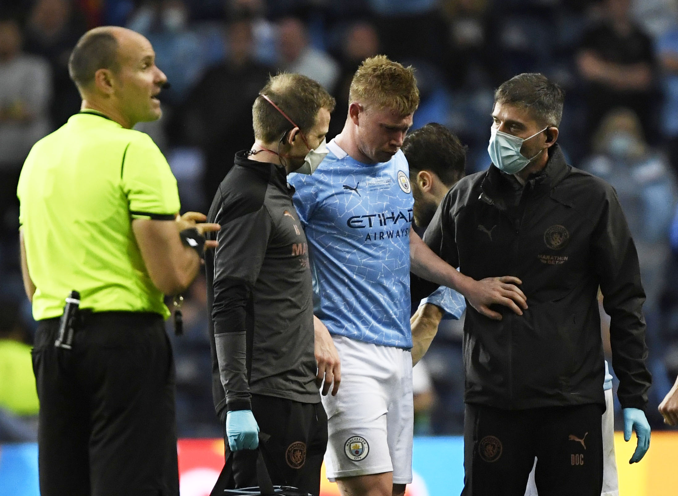 Manchester City’s Kevin De Bruyne is brought off the pitch after sustaining an injury
