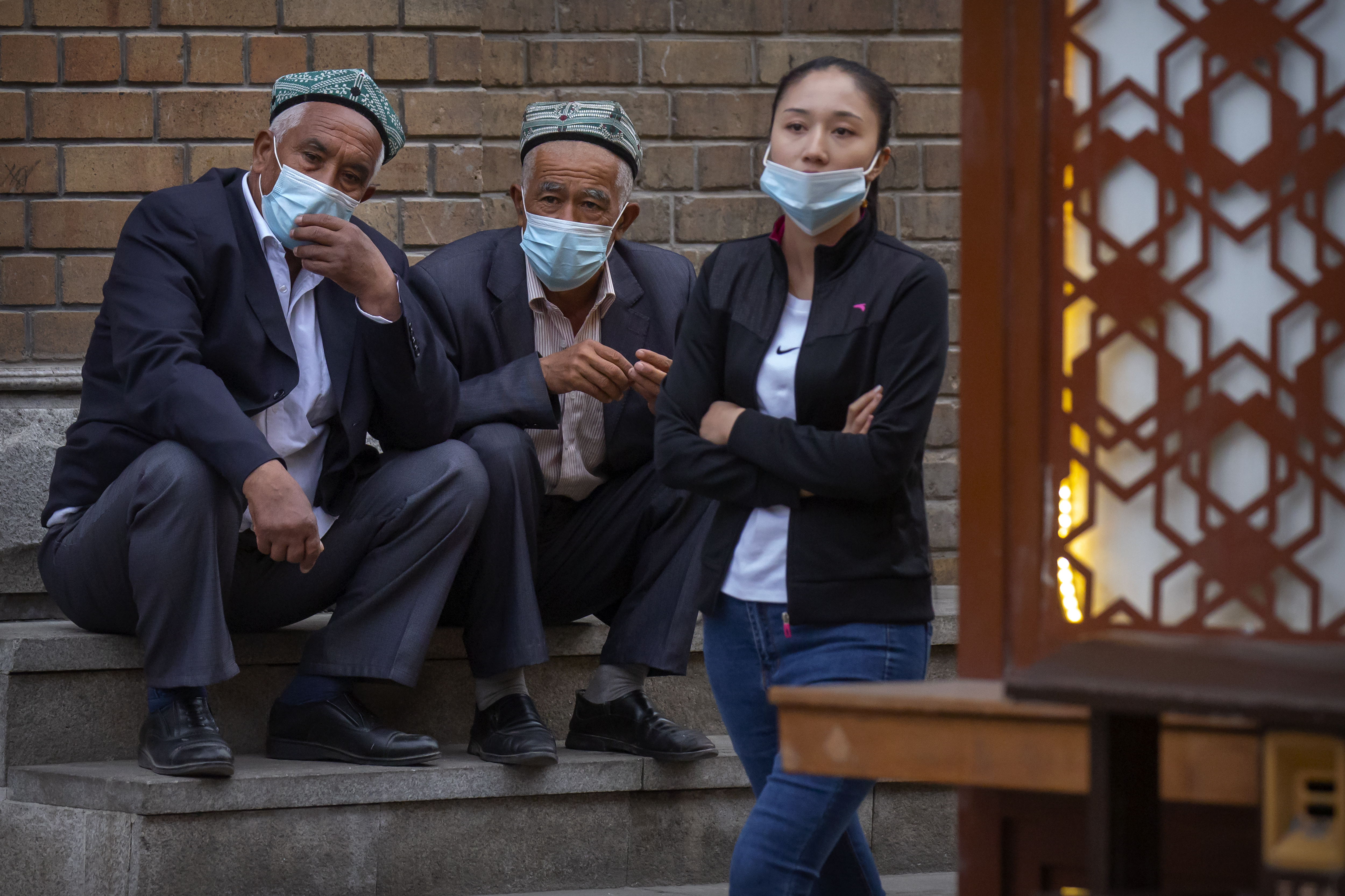 Uighur people watching a dance performance at the International Grand Bazaar in Urumqi in western China’s Xinjiang region